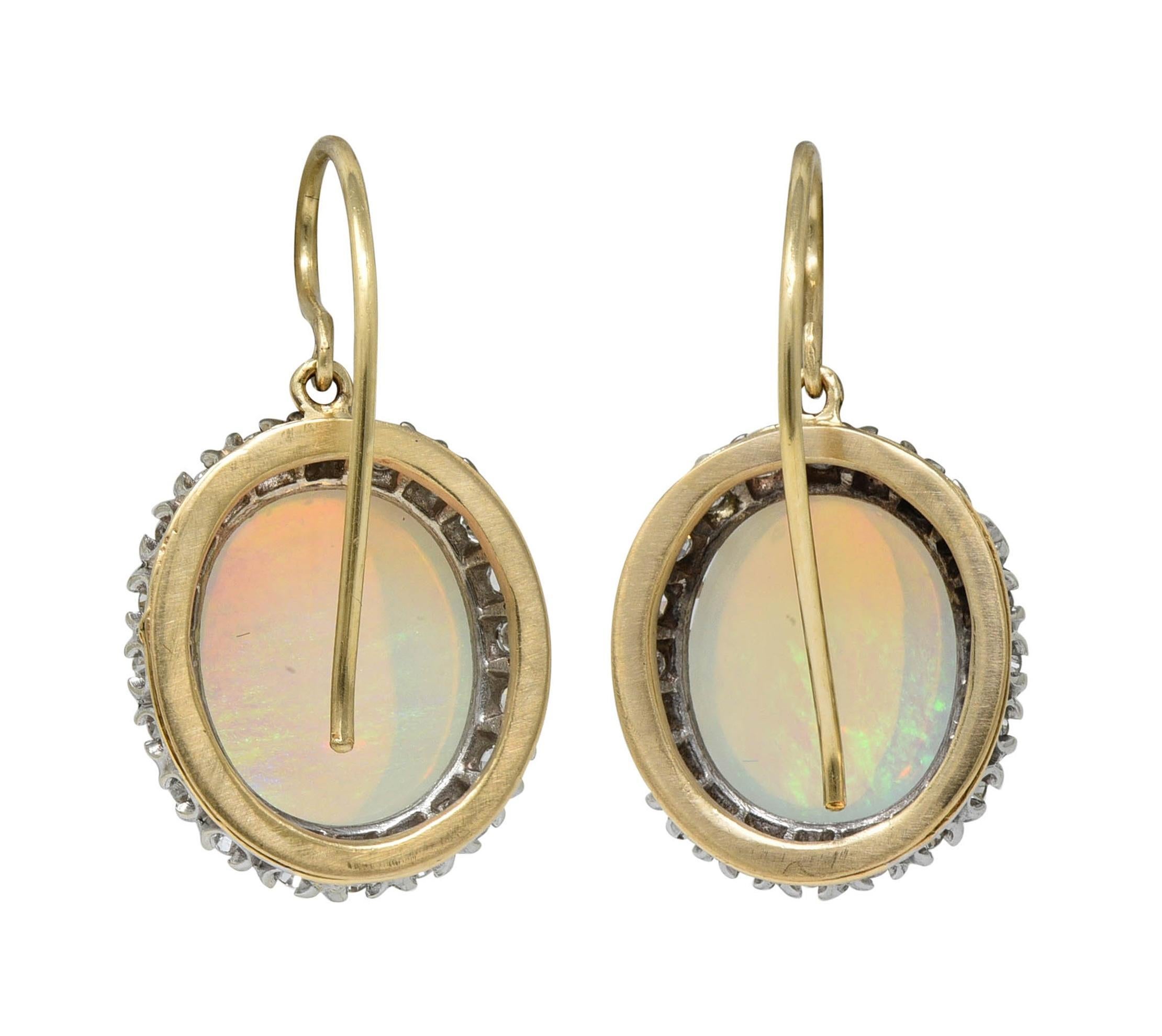 Mid-Century Opal Diamond 14 Karat Two-Tone Gold Vintage Halo Drop Earrings In Excellent Condition In Philadelphia, PA