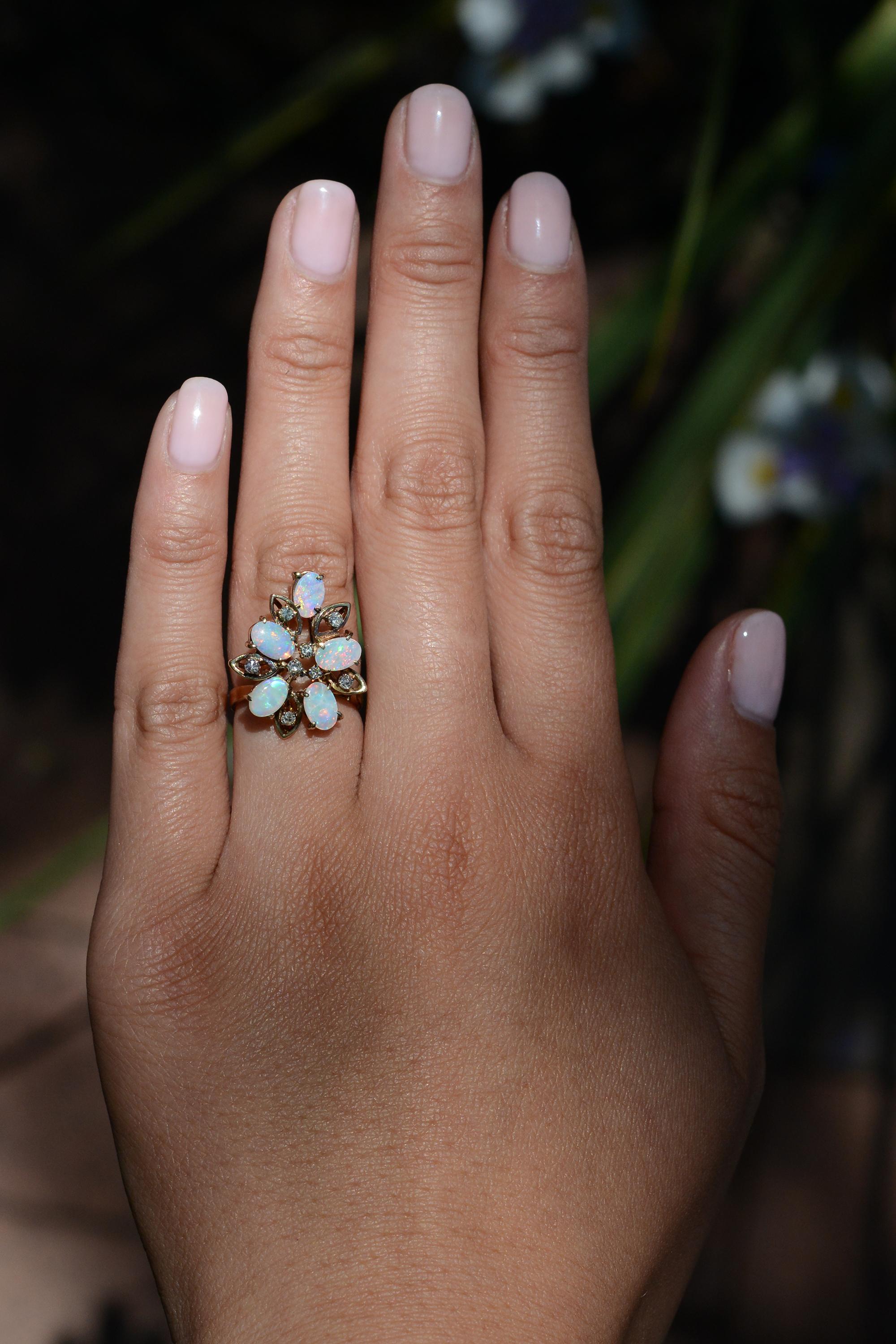 This affordable vintage 1970s cocktail ring is sure to turn heads. With airy openwork, a perfect pinky ring, (or on any finger) elongating the finger and accenting your other accessories. Its Mid Century flower cluster design features a dainty and