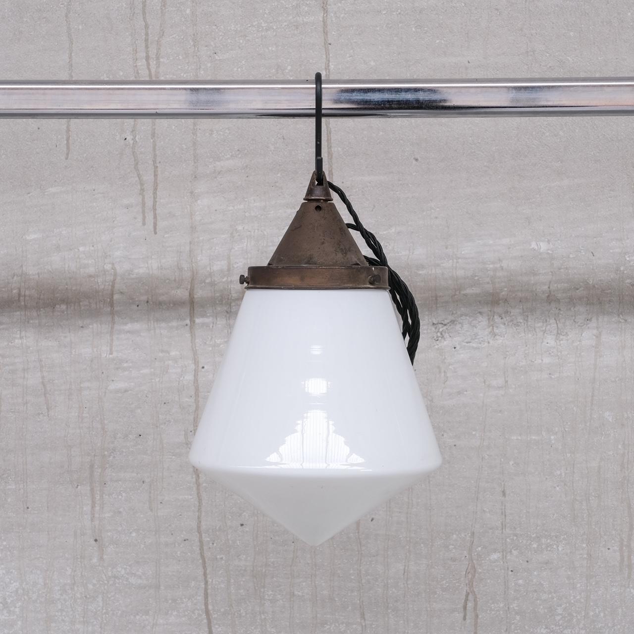 A well executed pendant light.

France, c1950s.

Opaline glass conical shade.

Good vintage condition, patina commensurate with age.

Re-wired and PAT tested.

No original chain or rose was retained but these are sourced easily