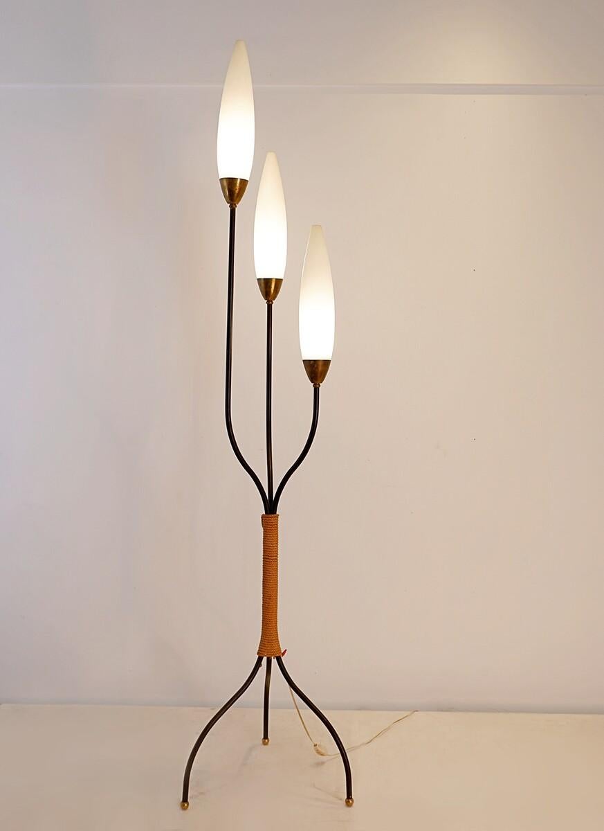 Simplistic floorlamp with three branches mounted with oval opaline lightbulbs.