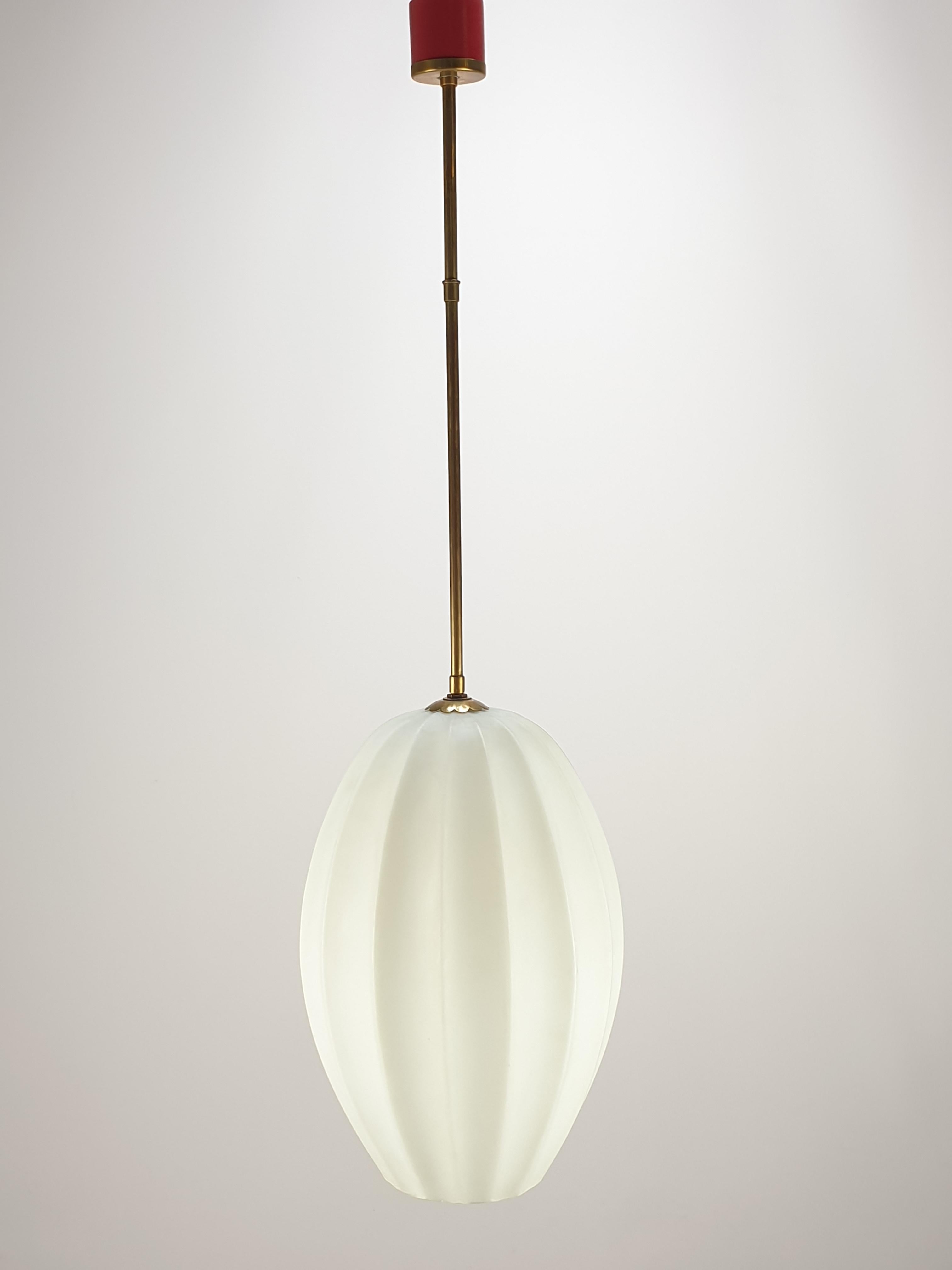 Stunning Italian lamp attributed to Stilnovo, circa 1958.

Elegant pendant lamp with striped satin white glass and brass accents. 
See the lovely details on the pictures.

The lamp gives a wonderful atmosphere in your room.