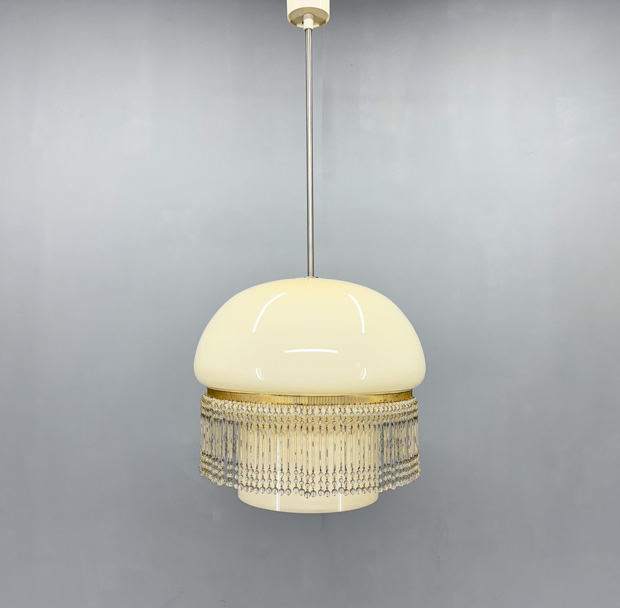Vintage pendant light made of opaline glass and beads. Manufactured in former Czechoslovakia in the 1960's. 
Bulbs: 1 x E27(E26). US wiring compatible.