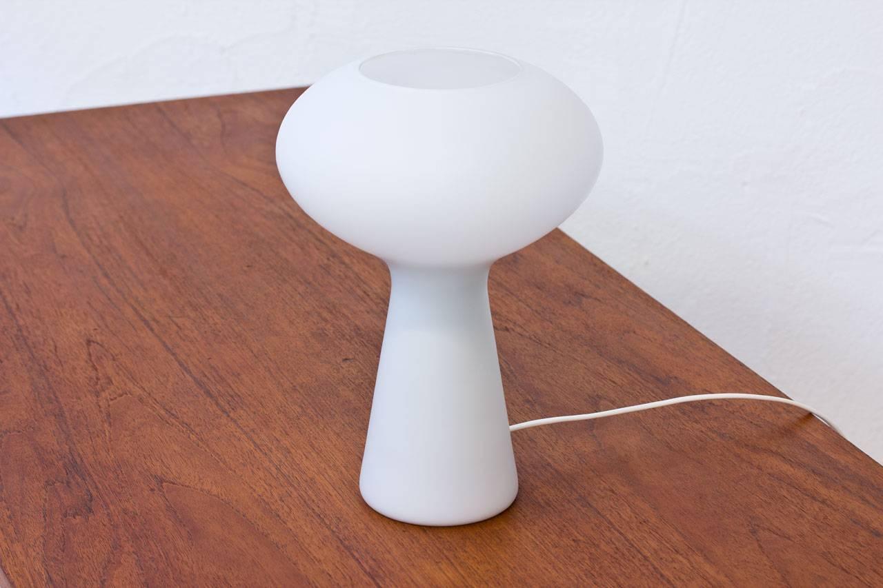 Organic shaped opaline glass table lamp designed by Uno Westerberg at Pukeberg glass maker for Böhlmarks, Sweden during the 1950s. Hand blown one piece glass diffuser. New wiring, light switch on the chord.