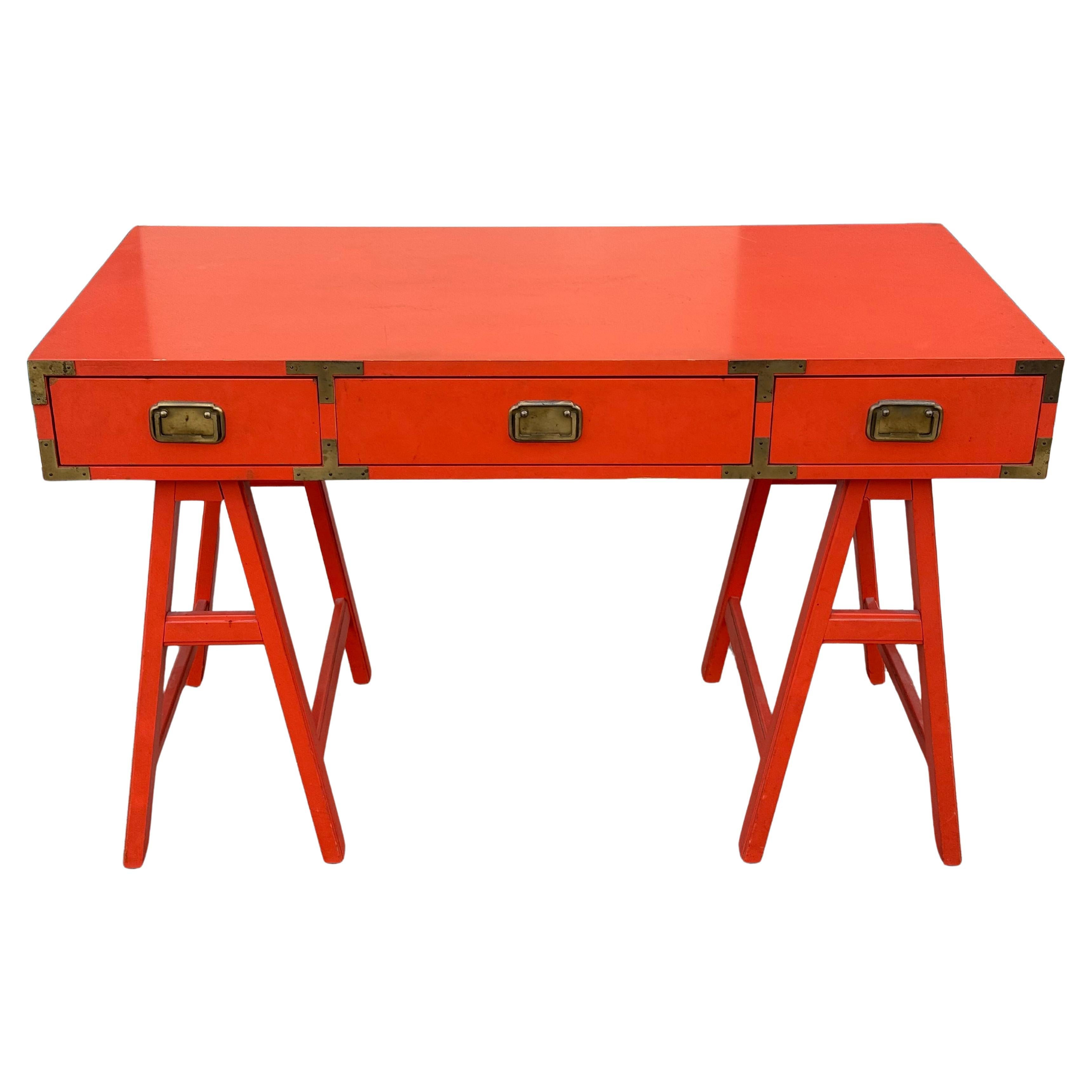 Very cool vintage orange Colormates Campaign Desk. Circa 1960s.

Striking design featuring three orange drawers with brass pulls and brass corner accents.

This piece is finished on both sides and will float in the room.

Width: 47.5 inches
Height: