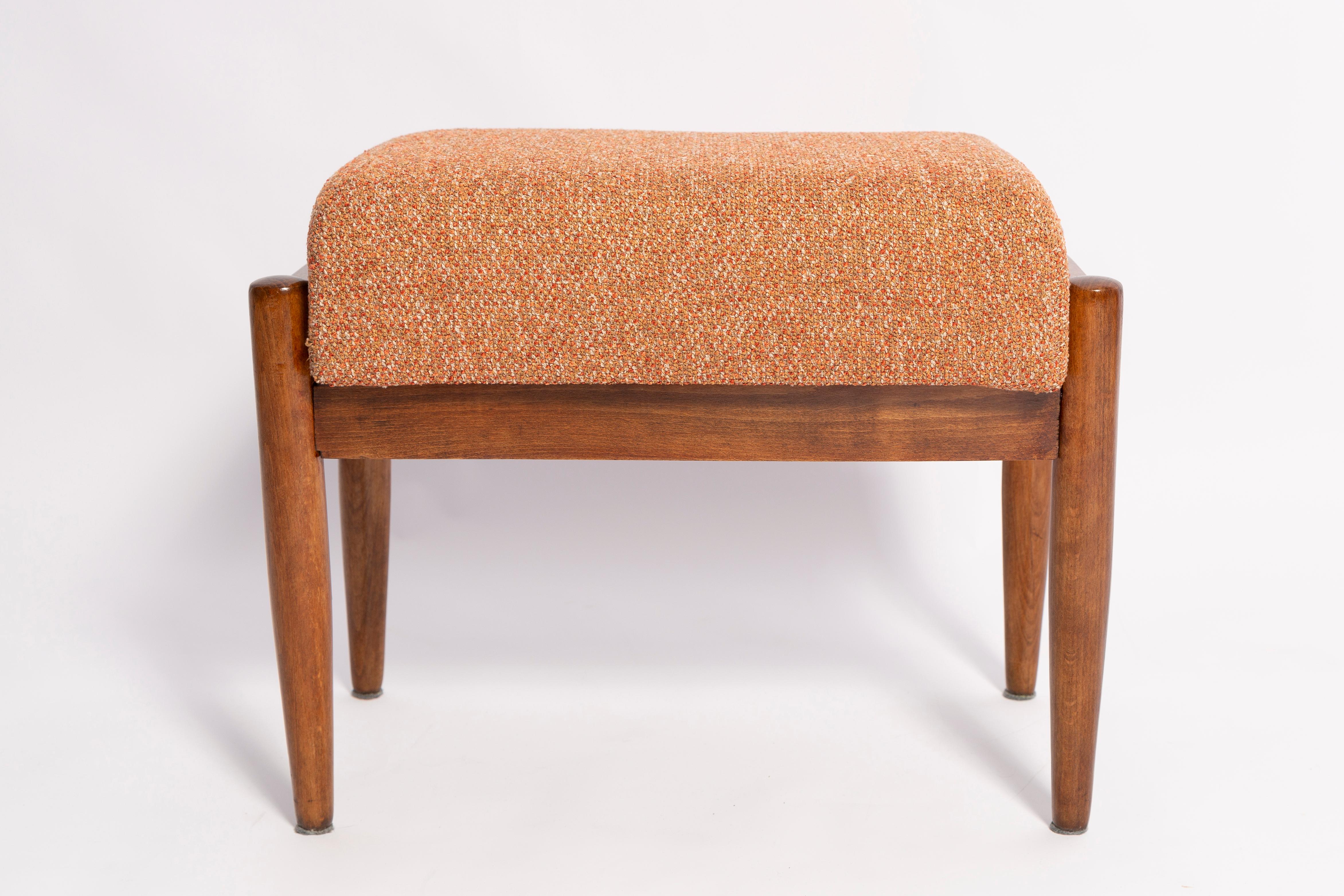 Stool from the turn of the 1960s. Beautiful bright orange high quality melange upholstery. The stools consists of an upholstered part, a seat and wooden legs narrowing downwards, characteristic of the 1960s style. We can prepare this stool also in