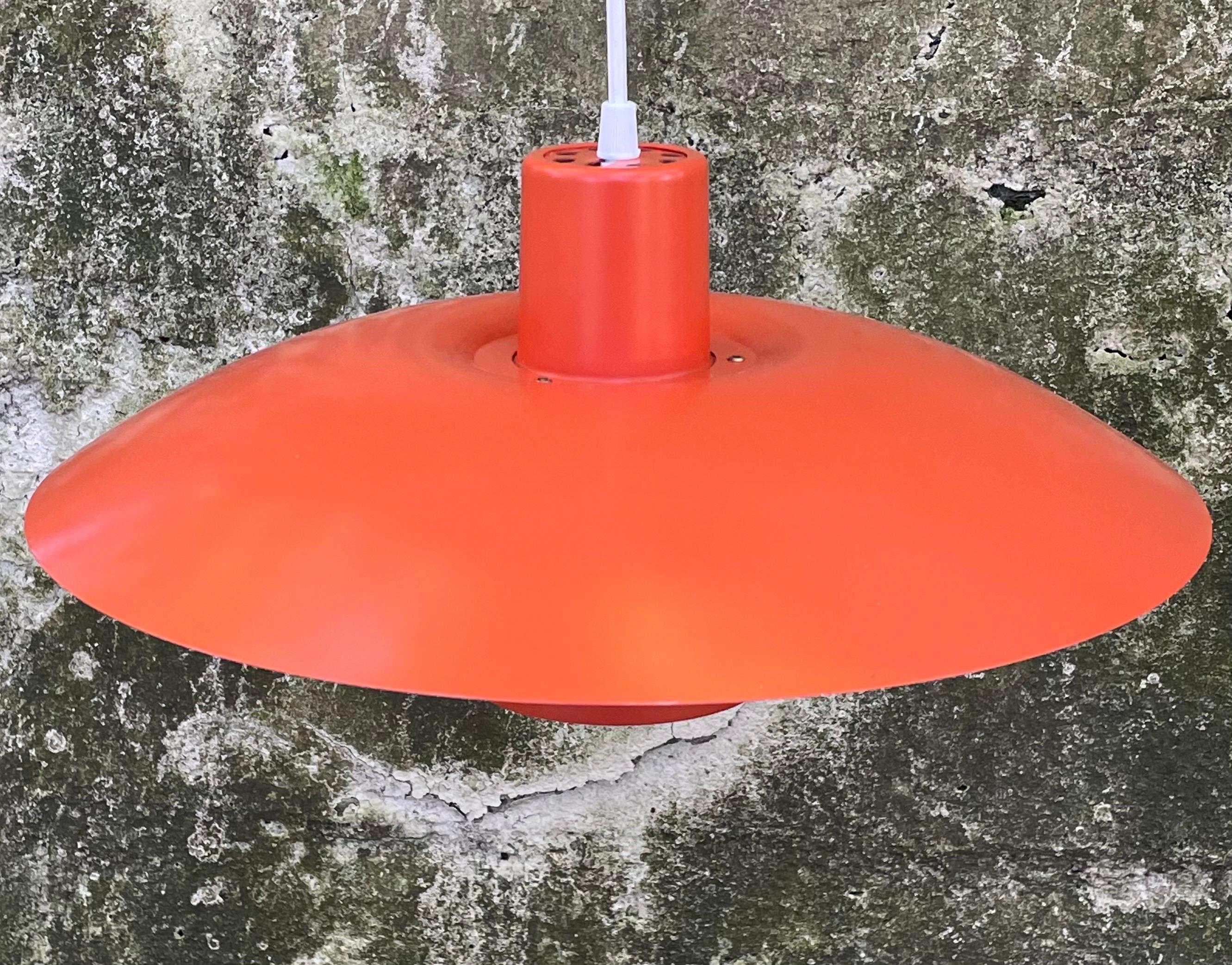 Authentic Mid Century Poul Henningsen for Louis Poulsen orange pendant light consisting of three curved shades.  Professionally rewired with approximately 8 feet of white coated wire. 