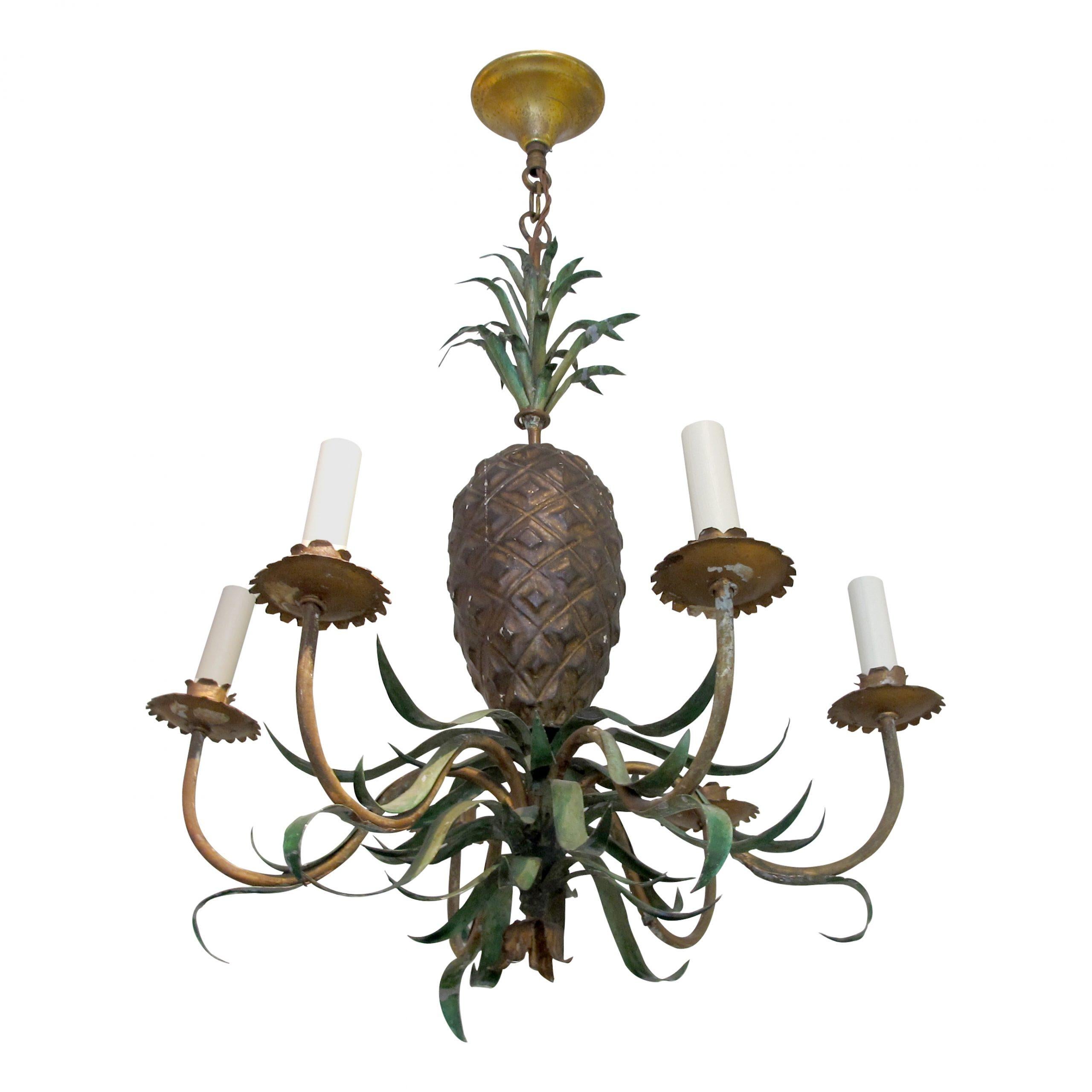 Hand-crafted mid-century French pineapple-shaped metal chandelier with six branches. The realistic hand-painted green metal leaves have acquired a beautiful patina commensurate with age.

Size: H80 cm x W60 cm x D60 cm 
6 Light bulb fitting -small