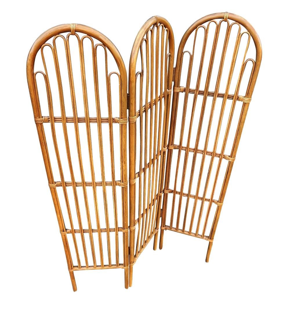 A vintage 1970s classic room divider in rattan. It features a tri-fold design in bamboo. The measurements are opened as shown. Ready to use condition.