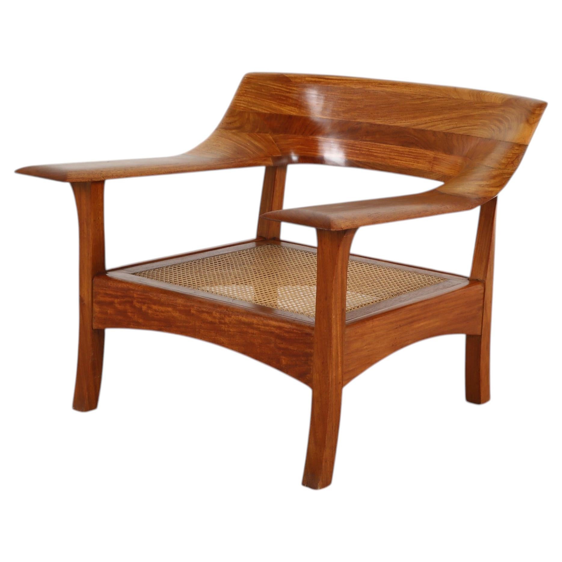 Mid-Century Organic Walnut Toned Lounge Chair with Cane Seat For Sale