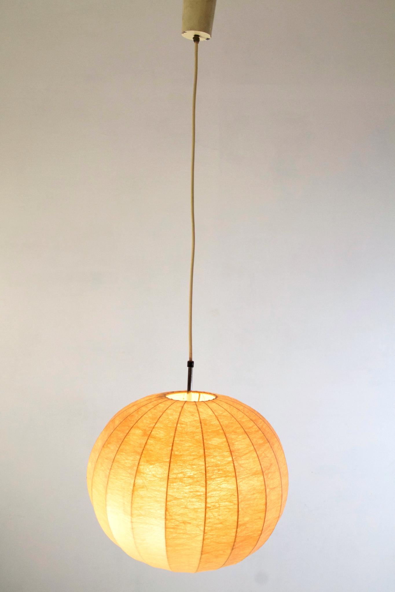 An original 1960s Cocoon pendant by Achille and Pier Giacomo Castiglioni. The lamp has one small older damage to the cover see pics.