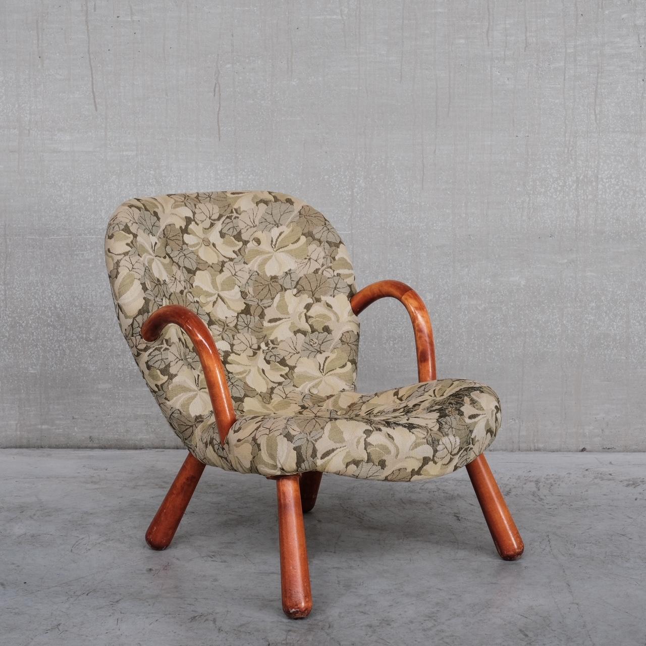 An increasingly hard to find 'clam' chair. 

Denmark, c1950s. 

Attributed to Arnold Madsen, similar models were made by Philip Arctander. 

Original fabric retained which has signs of age, and is ripe for re-upholstery, these are often done