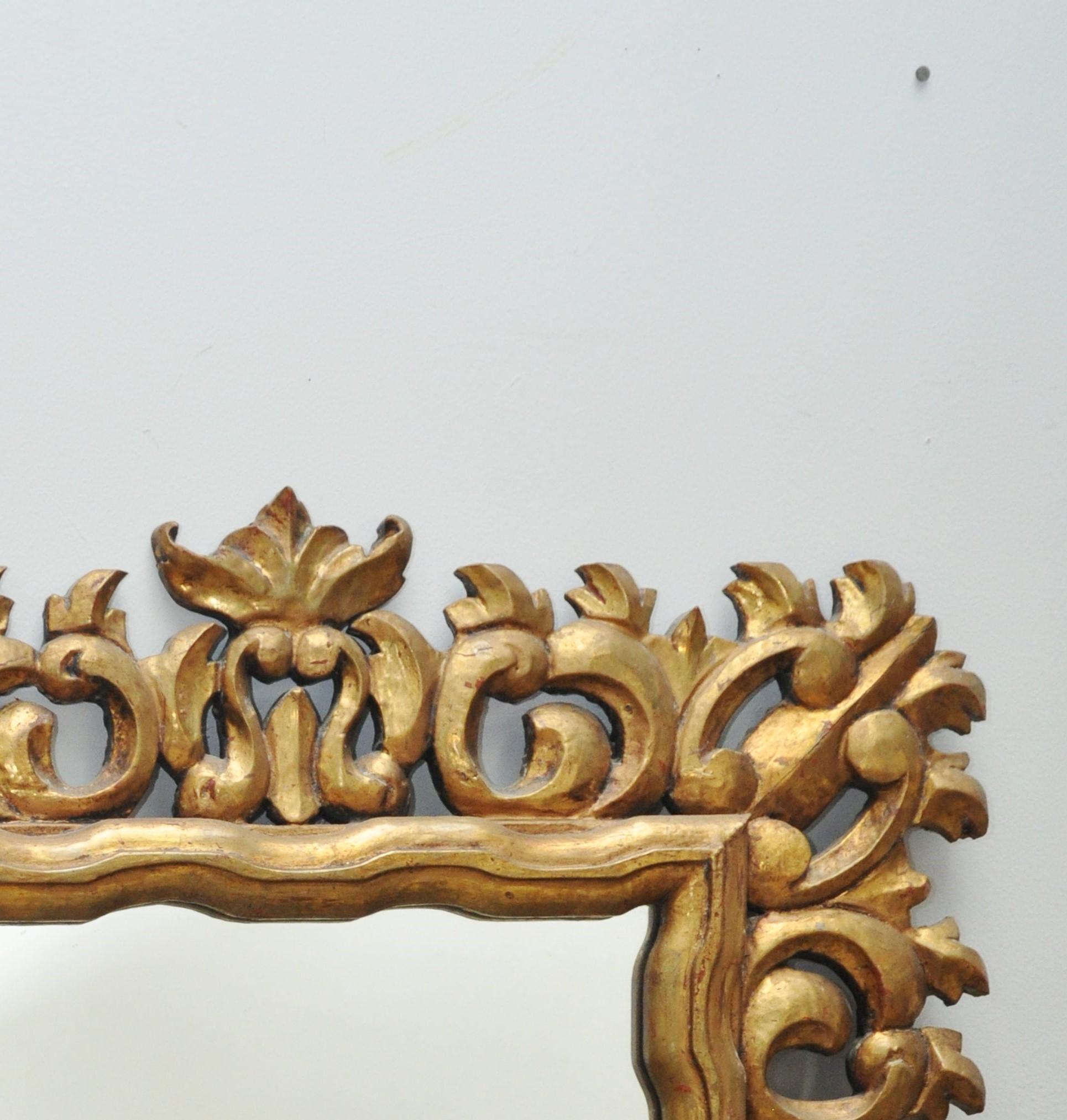 1960s ornate gold mirror. Mirrored portion is 14