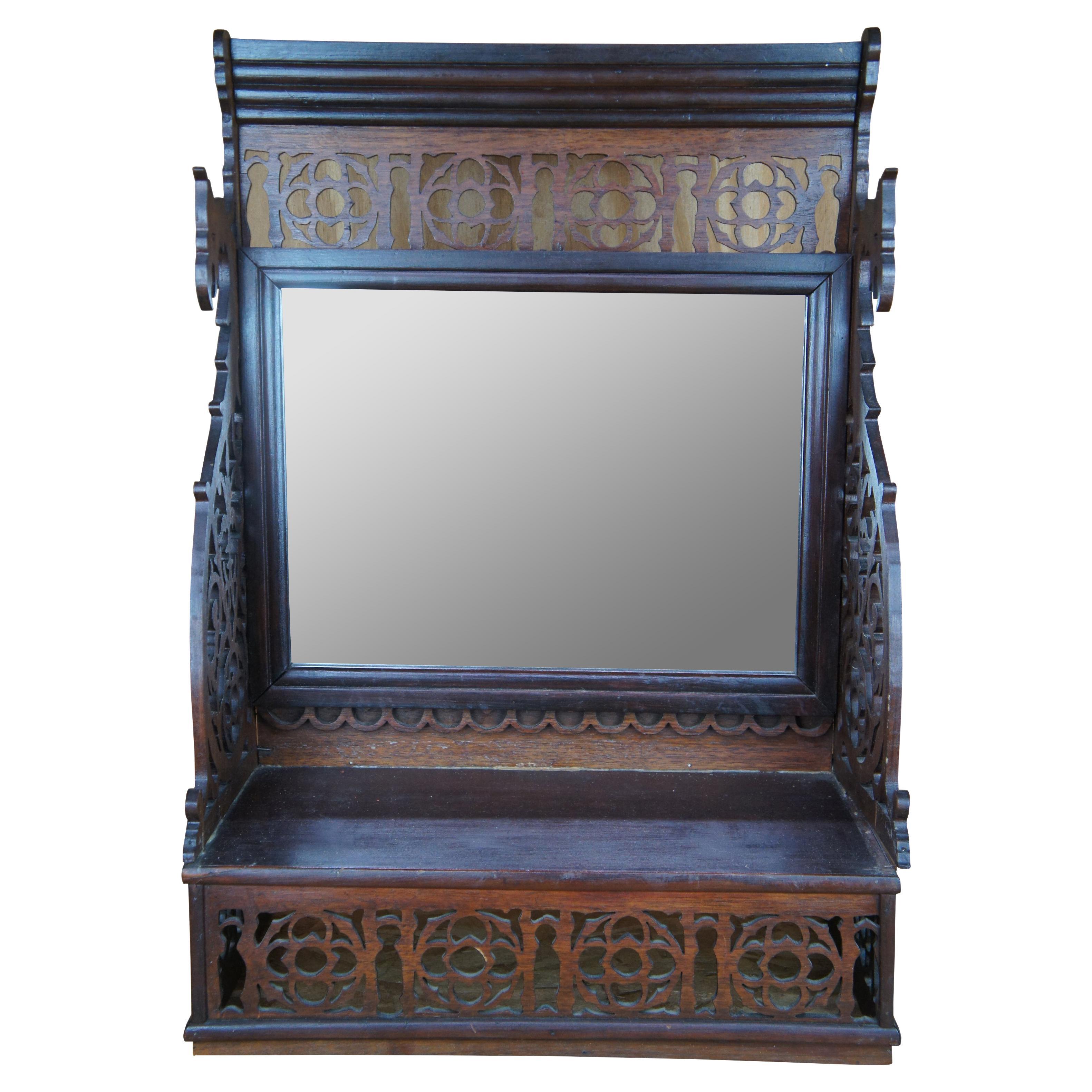 Antique desktop vanity shelf with mirror and beautiful fretwork. Features ornate carvings with dragon motif.
 