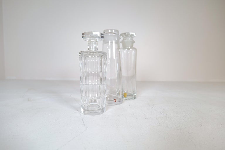 Elegant Mid-Century Modern vintage crystal decanters with stopper by Orrefors, Kosta and Johansfors. These ones from the classic glass manufacturers in Sweden and made in the 1950s. Wonderfully created these ones could make a nice addition the bar