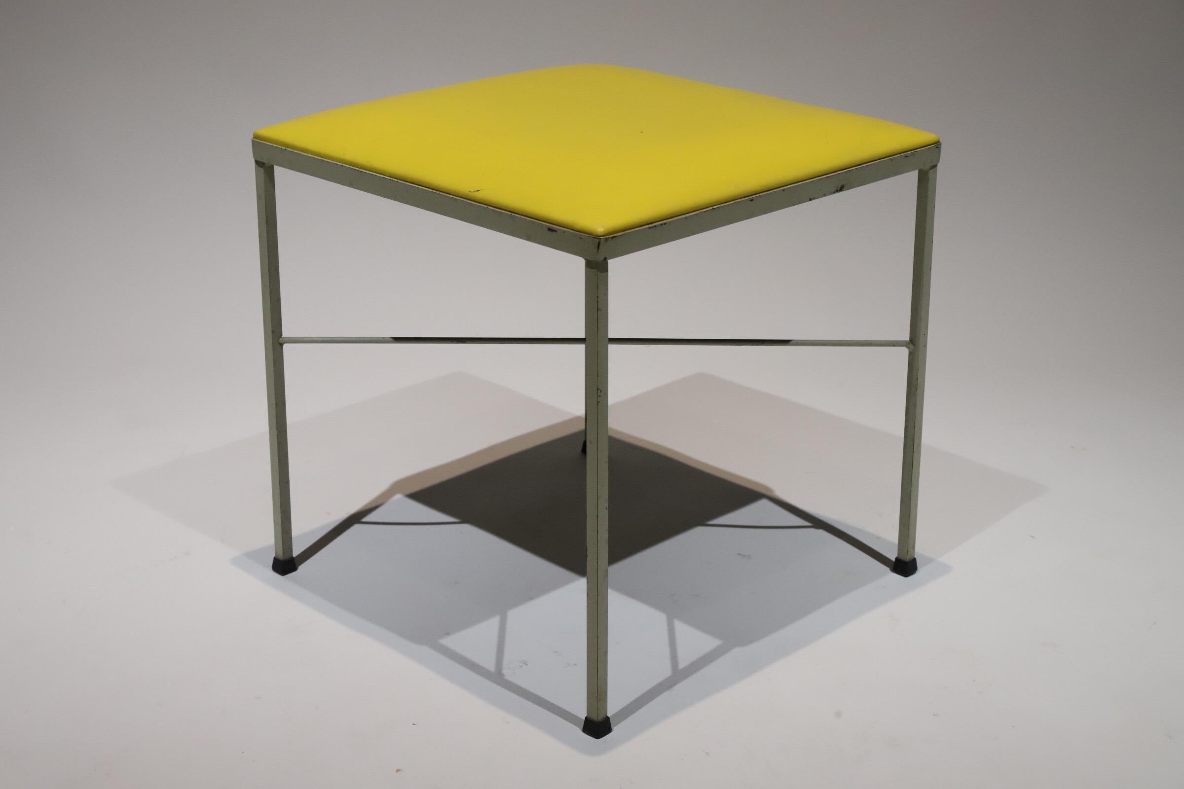 Yellow vinyl covered seat inset in metal base. Makes for a great stool or ottoman. Very much in the style of Paul Mccobb or Frederick Weinberg. Pictured with Knoll wire chair by Harry Bertoia for scale.