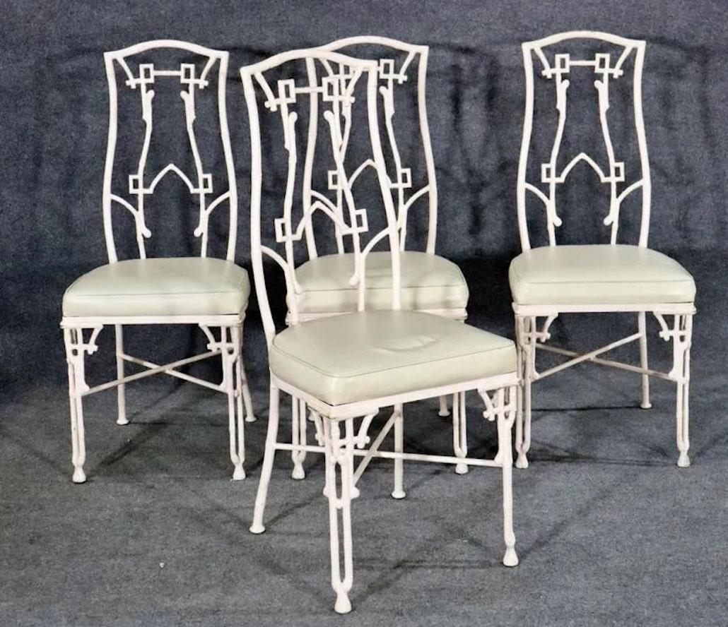 Set of four patio chairs made of strong iron frames and vinyl seating. Handsome Hollywood Regency style decorated frames.
Please confirm location NY or NJ.