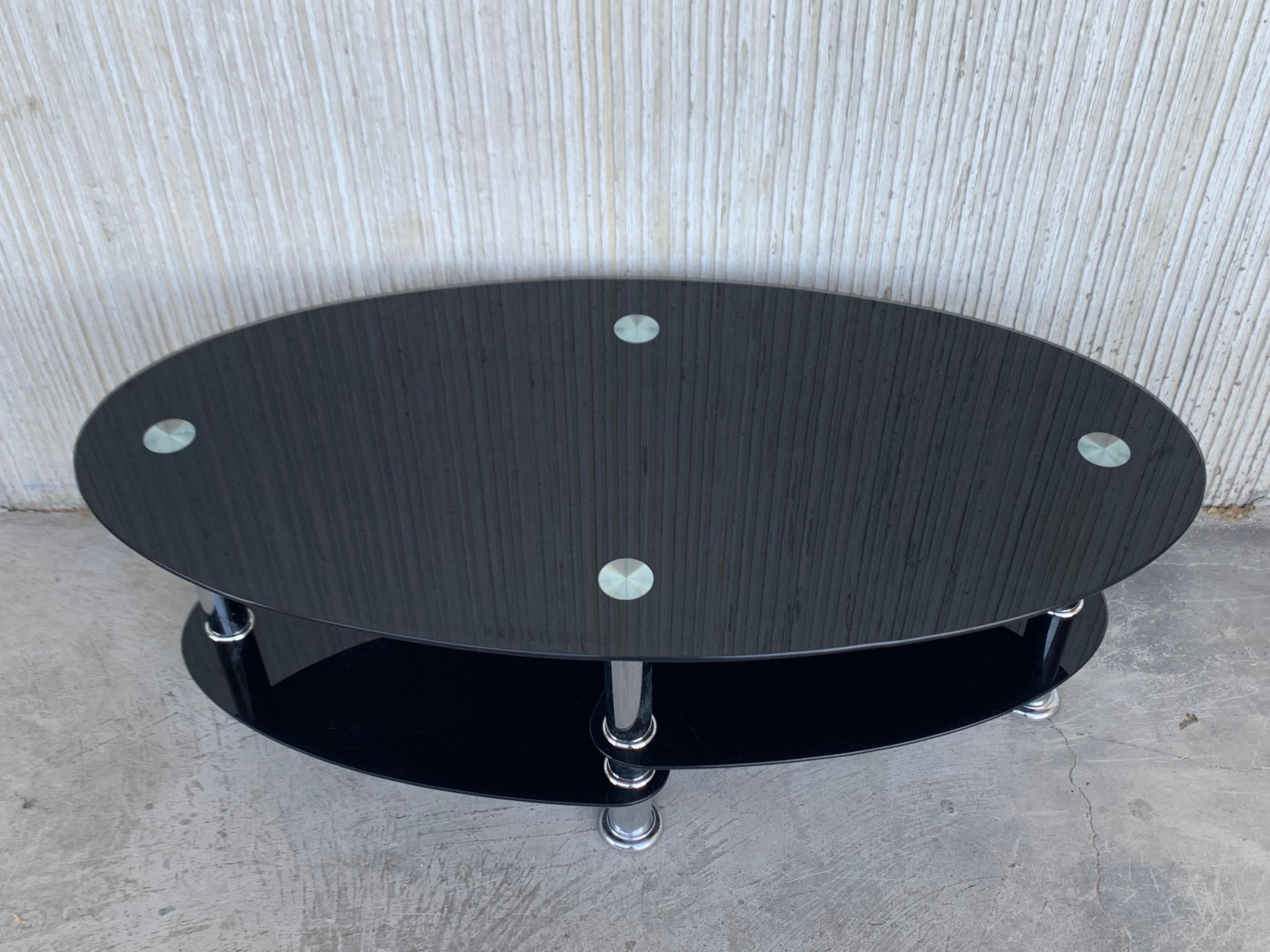 Table centrale ovale Art Déco du milieu du siècle dernier avec plateau en verre noir et chrome en vente 5
