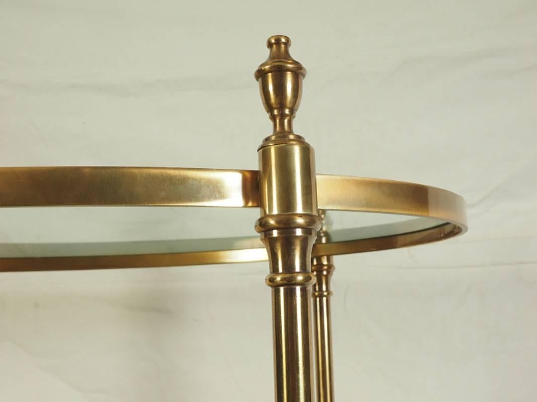 Vintage brass étagère with oval form with good proportions and great style. Turned cast standards terminating with brass finials and resting on hoof feet.
Condition: Some shelves do not insert perfectly; one shelf with large chip to rim; few light