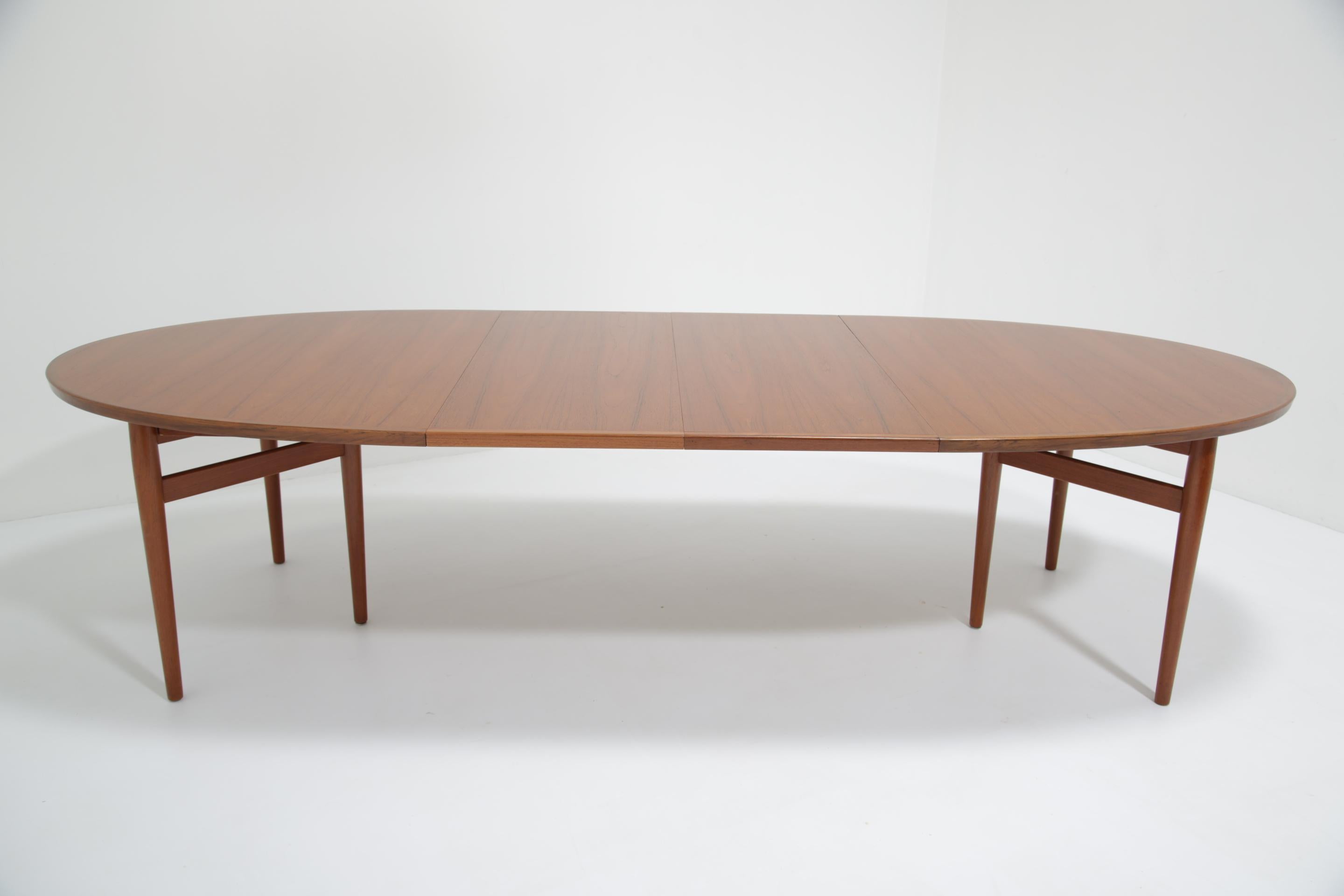 In our opinion, one of the most beautiful dining tables ever produced in teak. Featuring two table extension leaves, this table can seat 4 - 10 guests comfortably. In the photos, we have paired the table with a set of Niels Otto Moller Model 78
