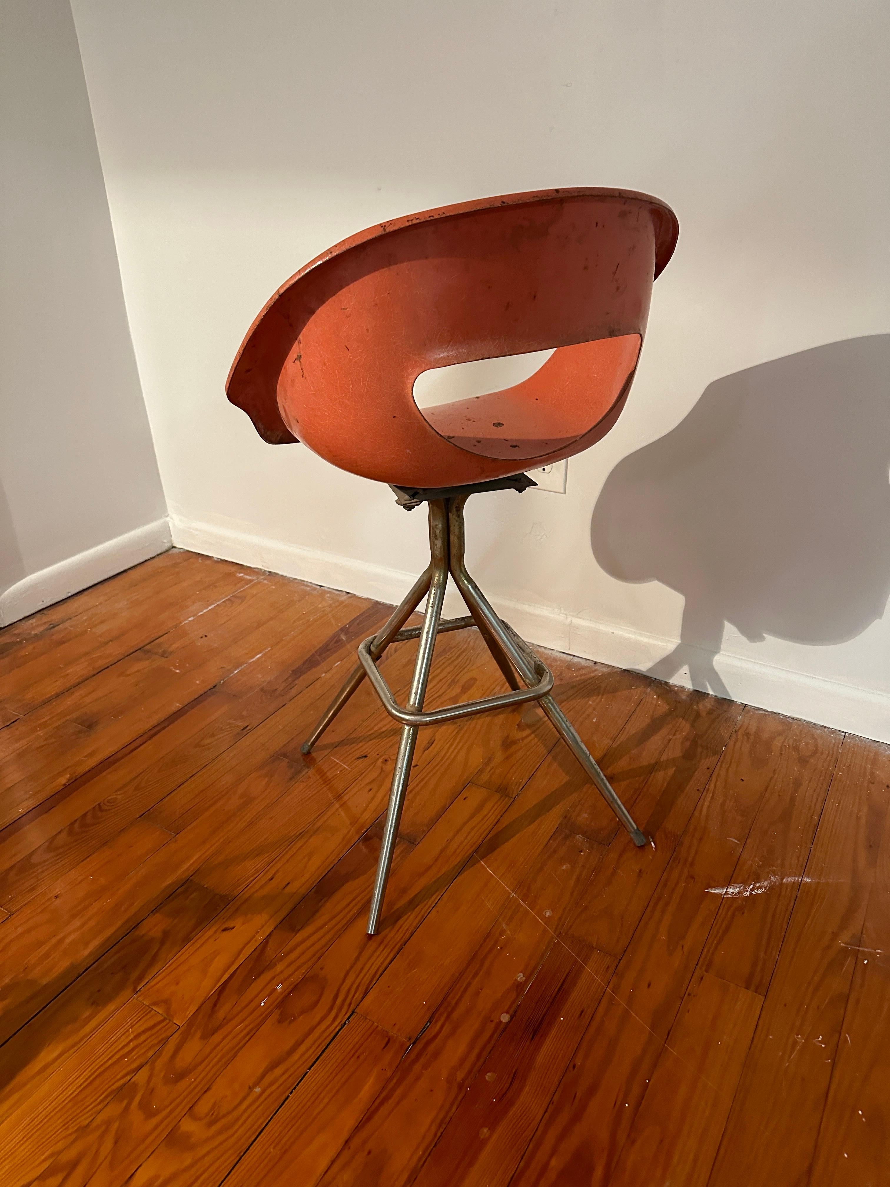 This is a mid century fiberglass chair- this condition is in overall good condition, with scattered resin drop from prior owners use. Can be cleaned and restored.