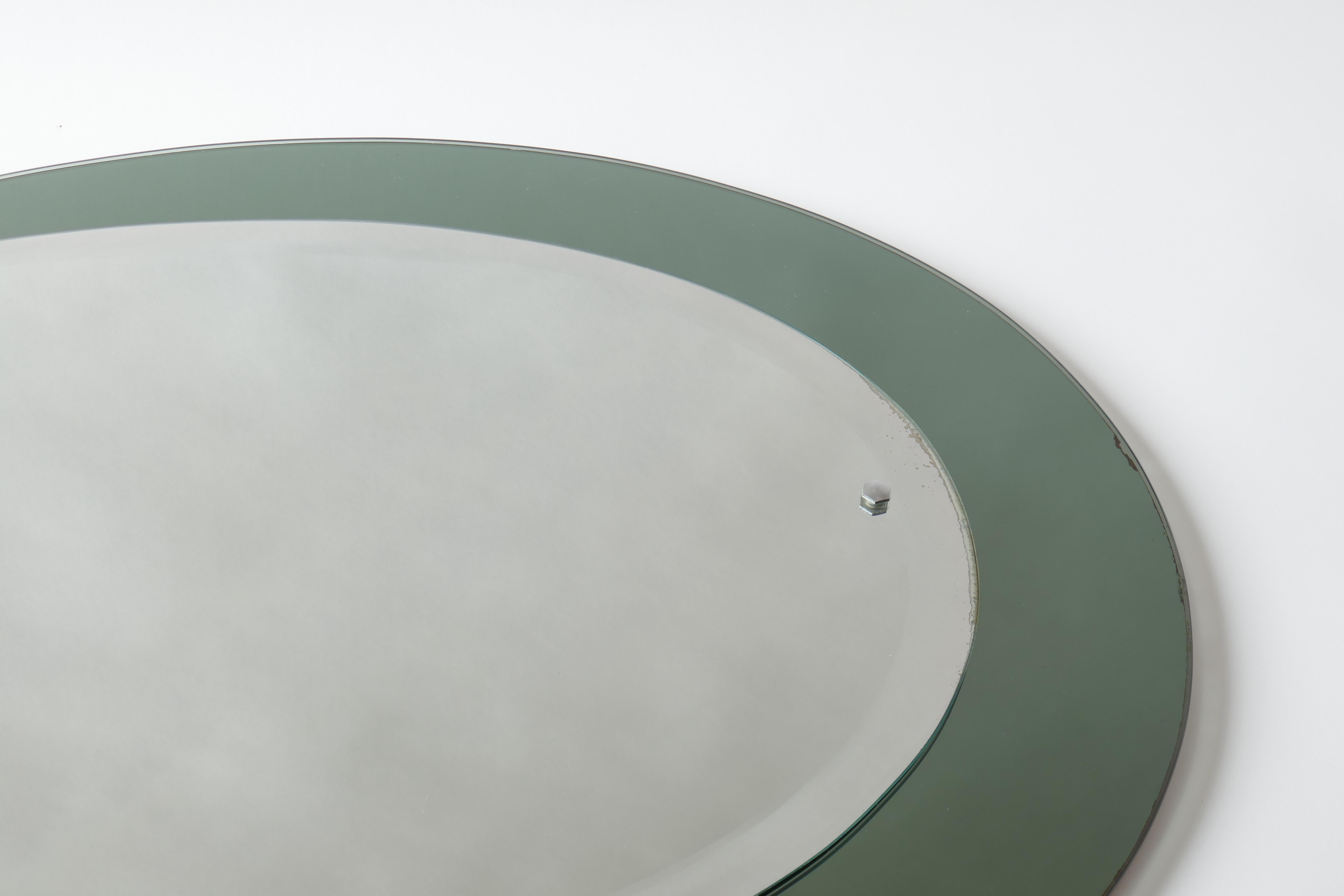 Mid-Century Modern Mid-Century Oval Mirror with a Green Smoked Mirrored Frame, Italy For Sale
