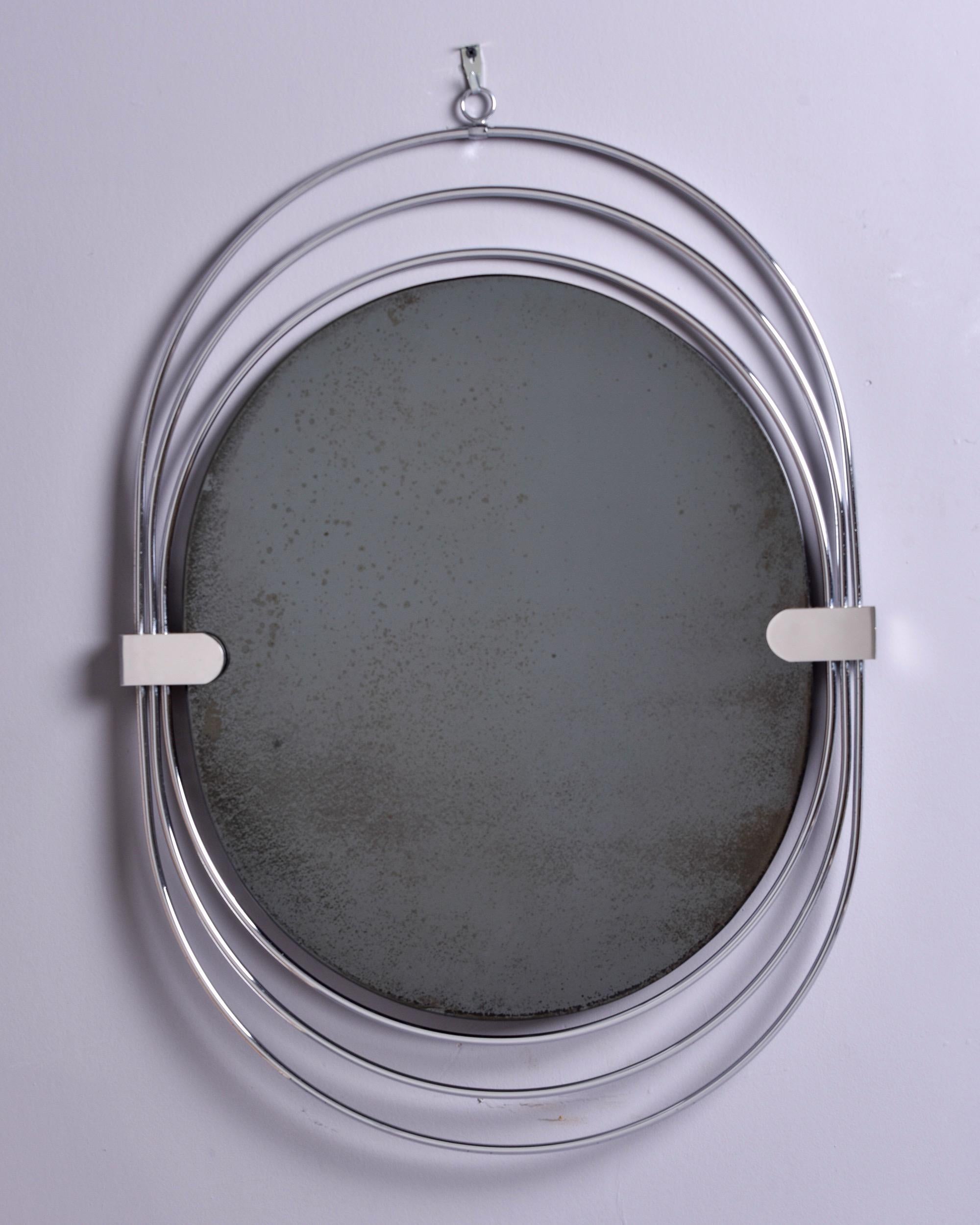 Mid-Century Modern Miroir ovale mi-siècle avec cadre à trois anneaux chromés en vente