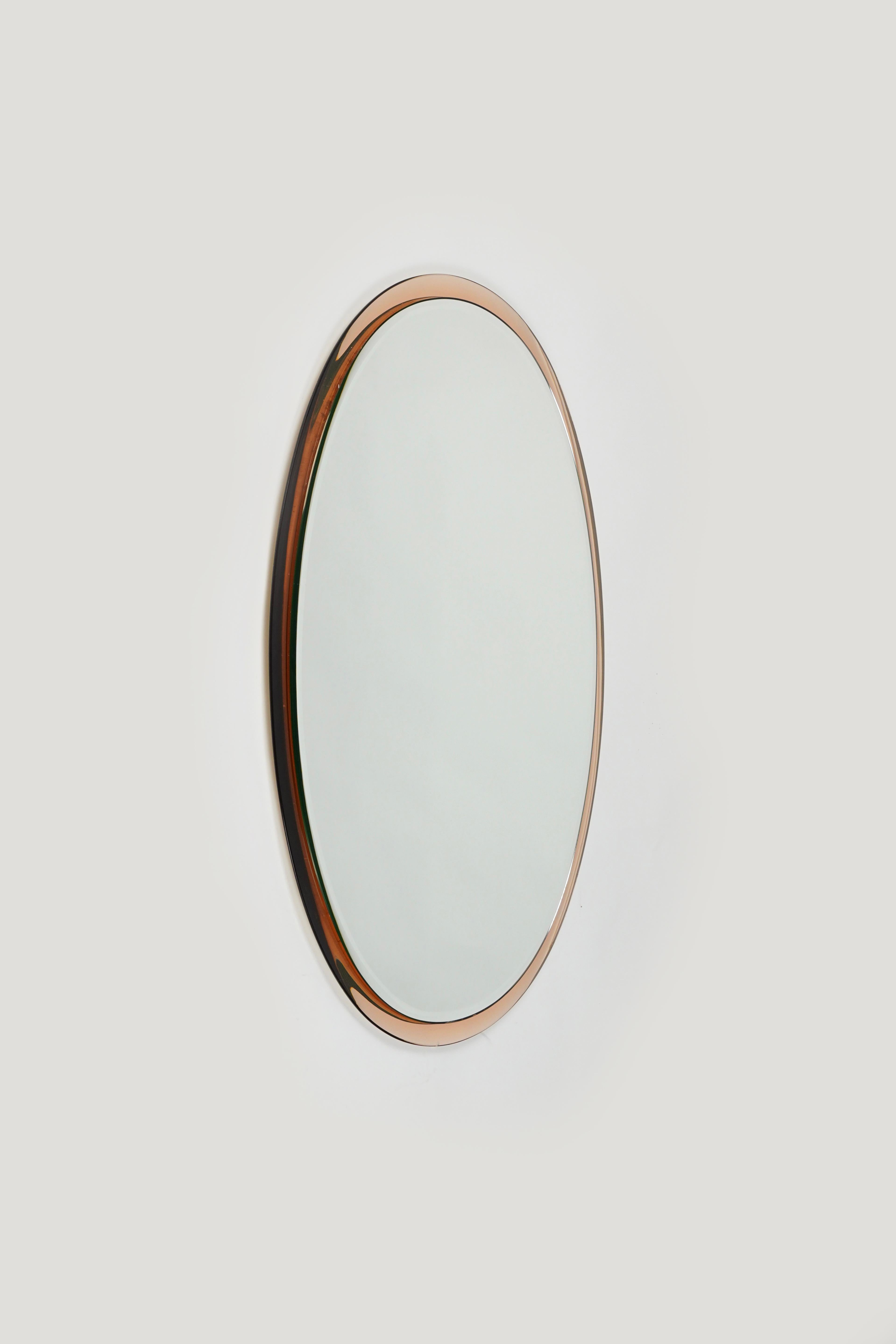 Midcentury oval wall mirror with pink colored mirror frame by Metalvetro Galvorame.

Made in Italy in the 1970s.

The mirror is very well-made, heavy and in good vintage condition.

The mirror would be perfect for a bedroom, dressing room, cloakroom