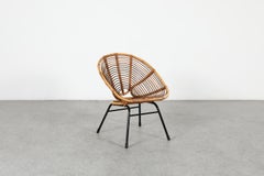 Poltrona relax ovale in rattan in stile Franco Albini, risalente alla metà del secolo scorso