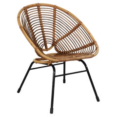 Poltrona relax ovale in rattan in stile Franco Albini, risalente alla metà del secolo scorso