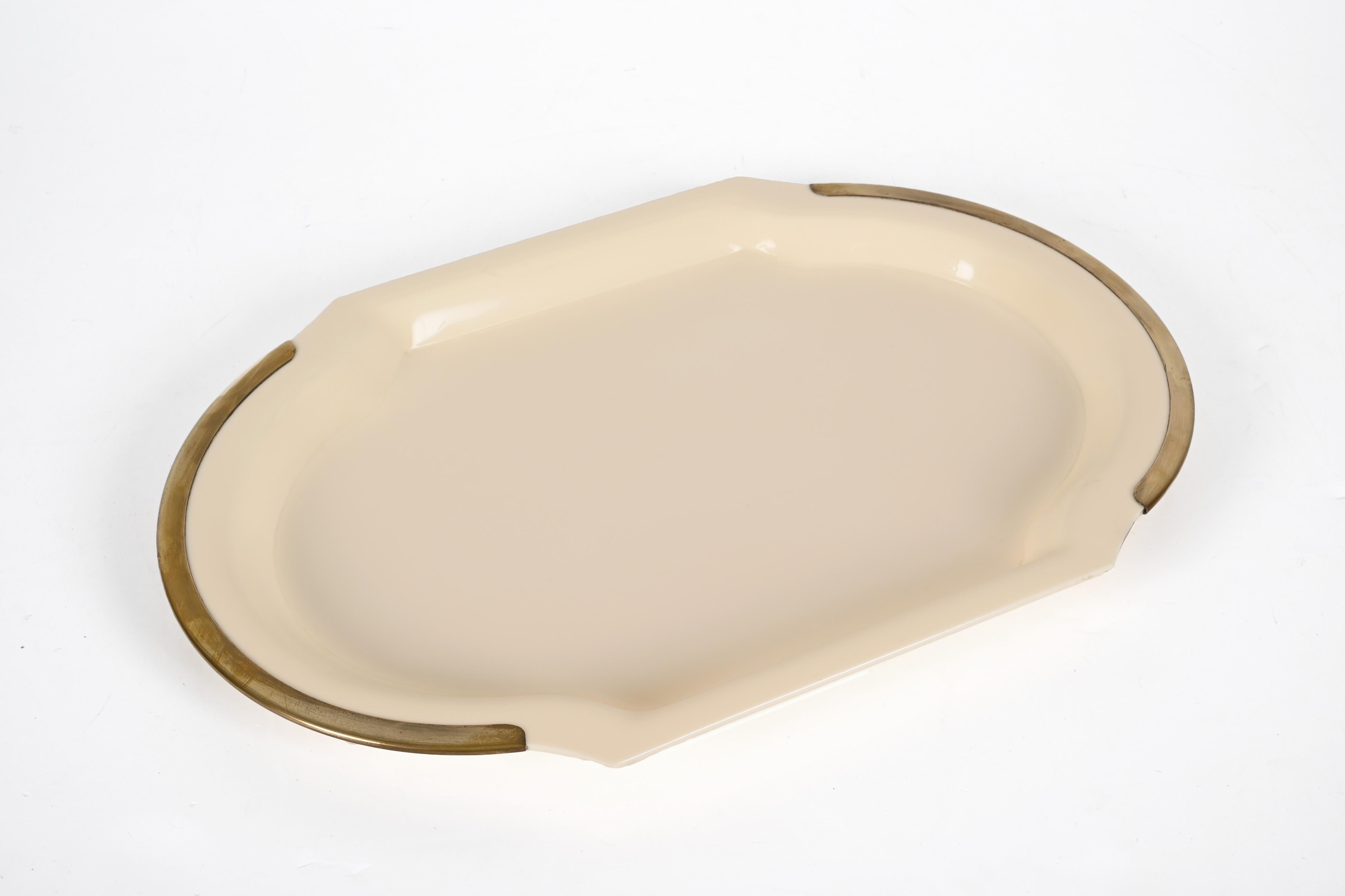 Wonderful cream lucite serving tray with mid-century brass edging. This wonderful piece was made in Italy in the 1980s.


A fantastic piece of service that will complement a modern living room or mid-century bar.
