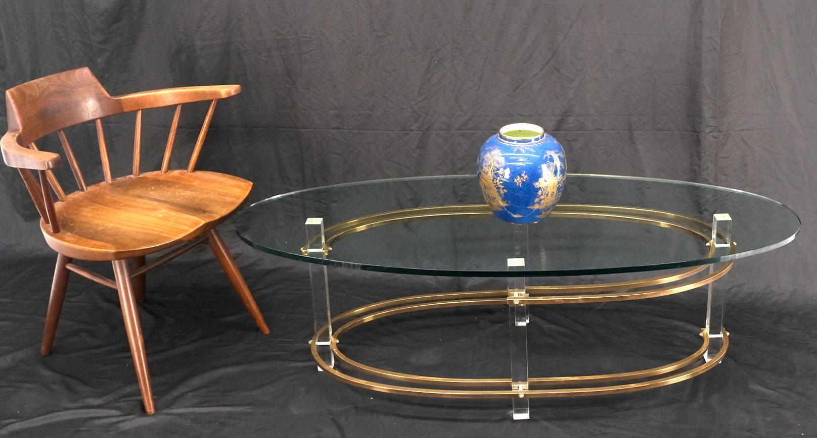 Mid-Century Oval Thick Glass Top Lucite Brass Base Coffee Table In Good Condition For Sale In Rockaway, NJ