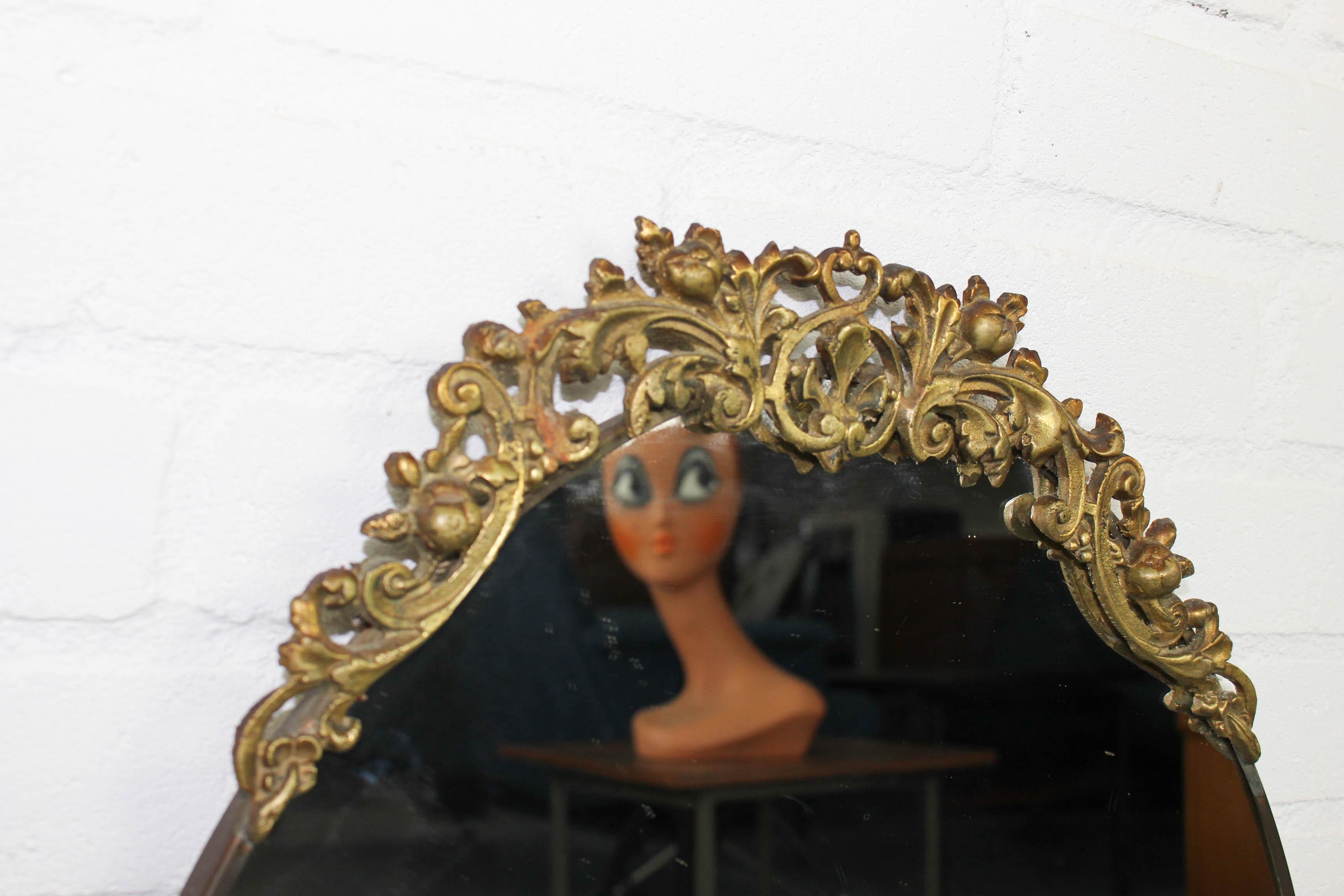 Mid-Century Modern Mid Century Oval Wall Mirror in Brass Frame with Top Ornament For Sale
