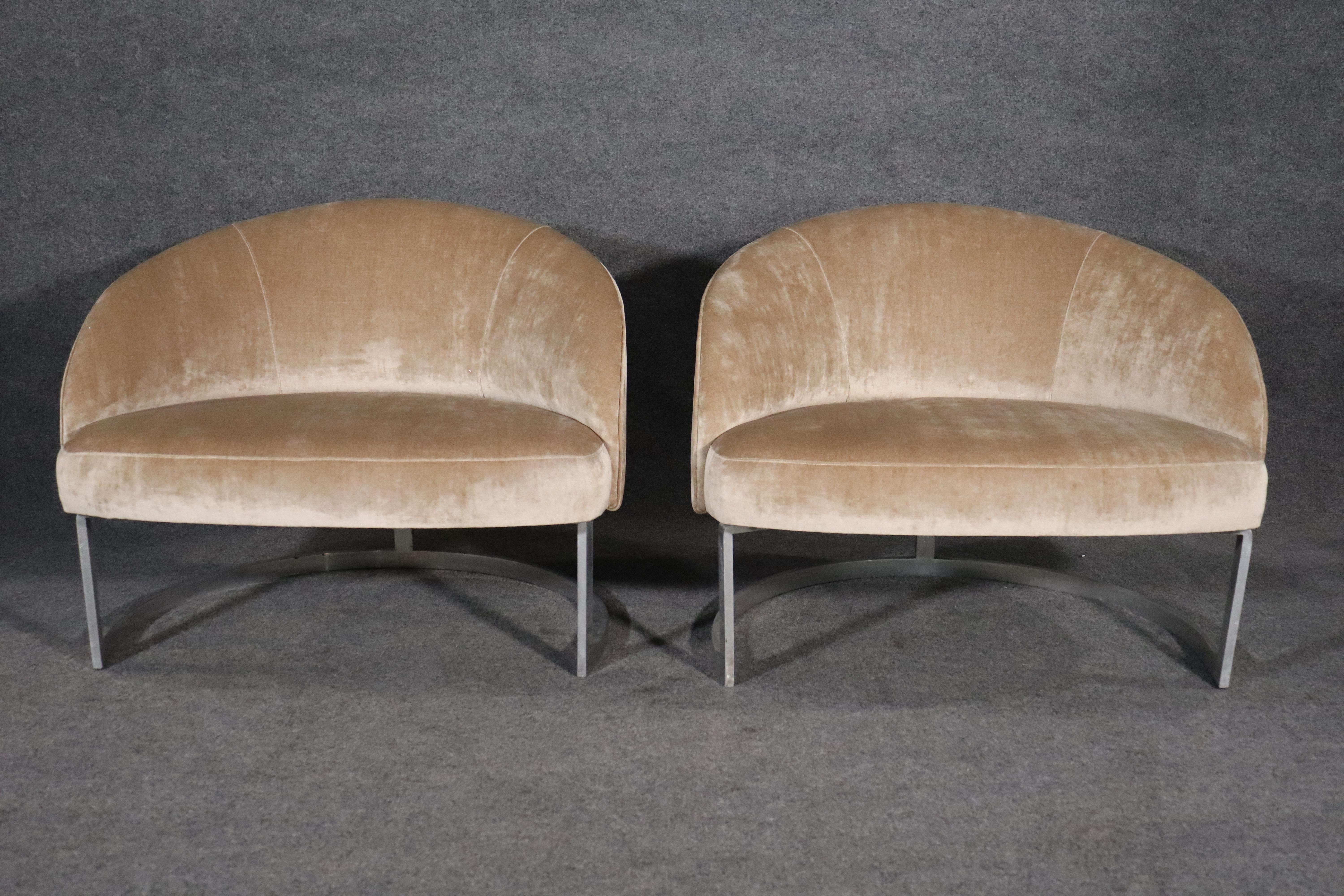 Round mid-century modern club chairs set on strong metal bases. Soft velvet like fabric accents the heavy metal base.
Please confirm location NY or NJ