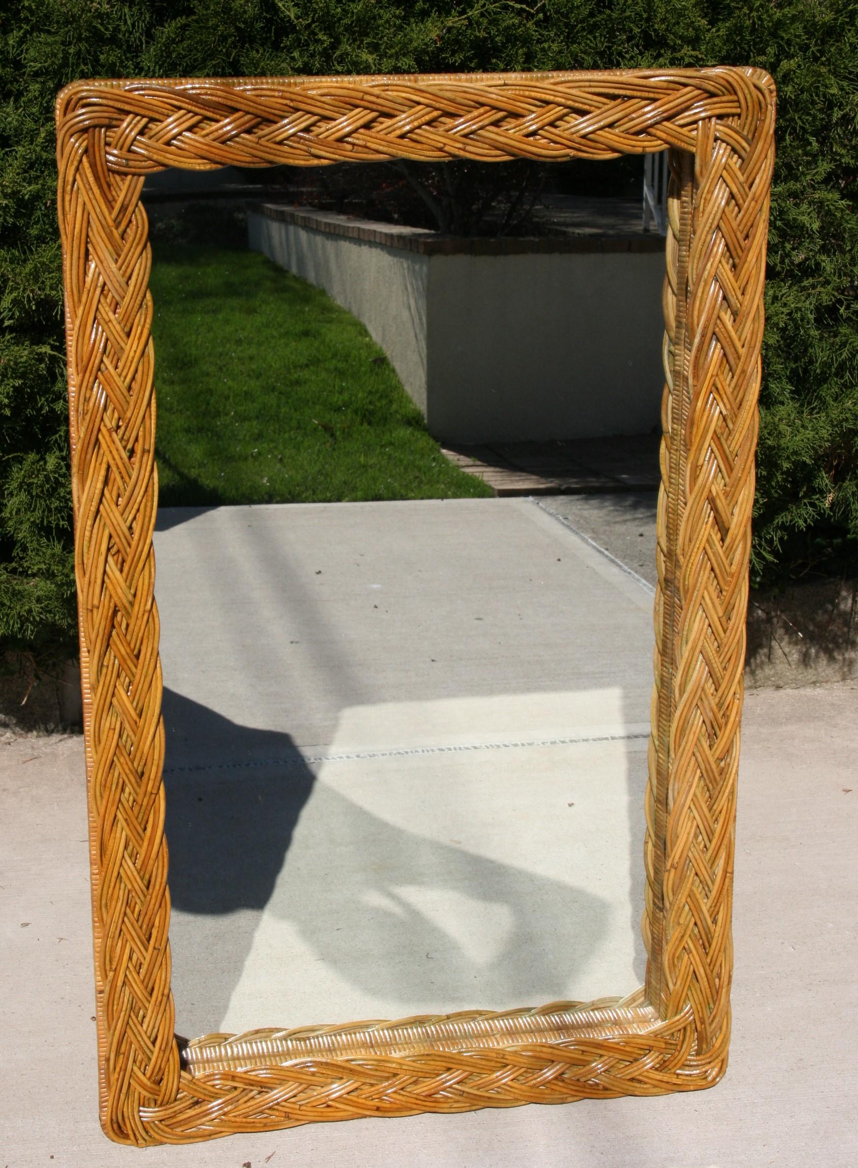 2-302 large wicker mirror with top level of braded rattan  and lower level of wrapped rattan.
