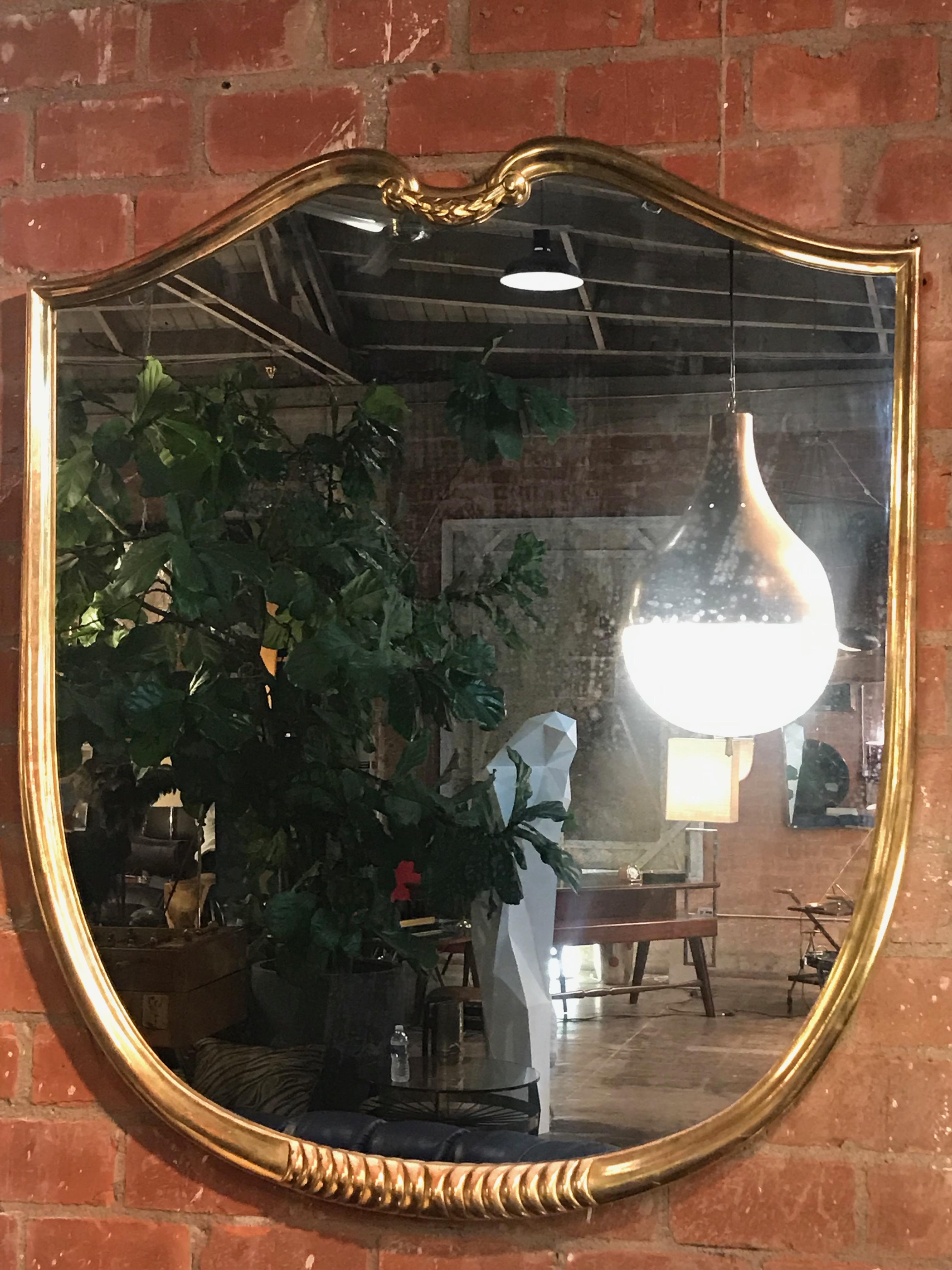 Midcentury oversized wall mirror gold leaves Italian design, 1950s.