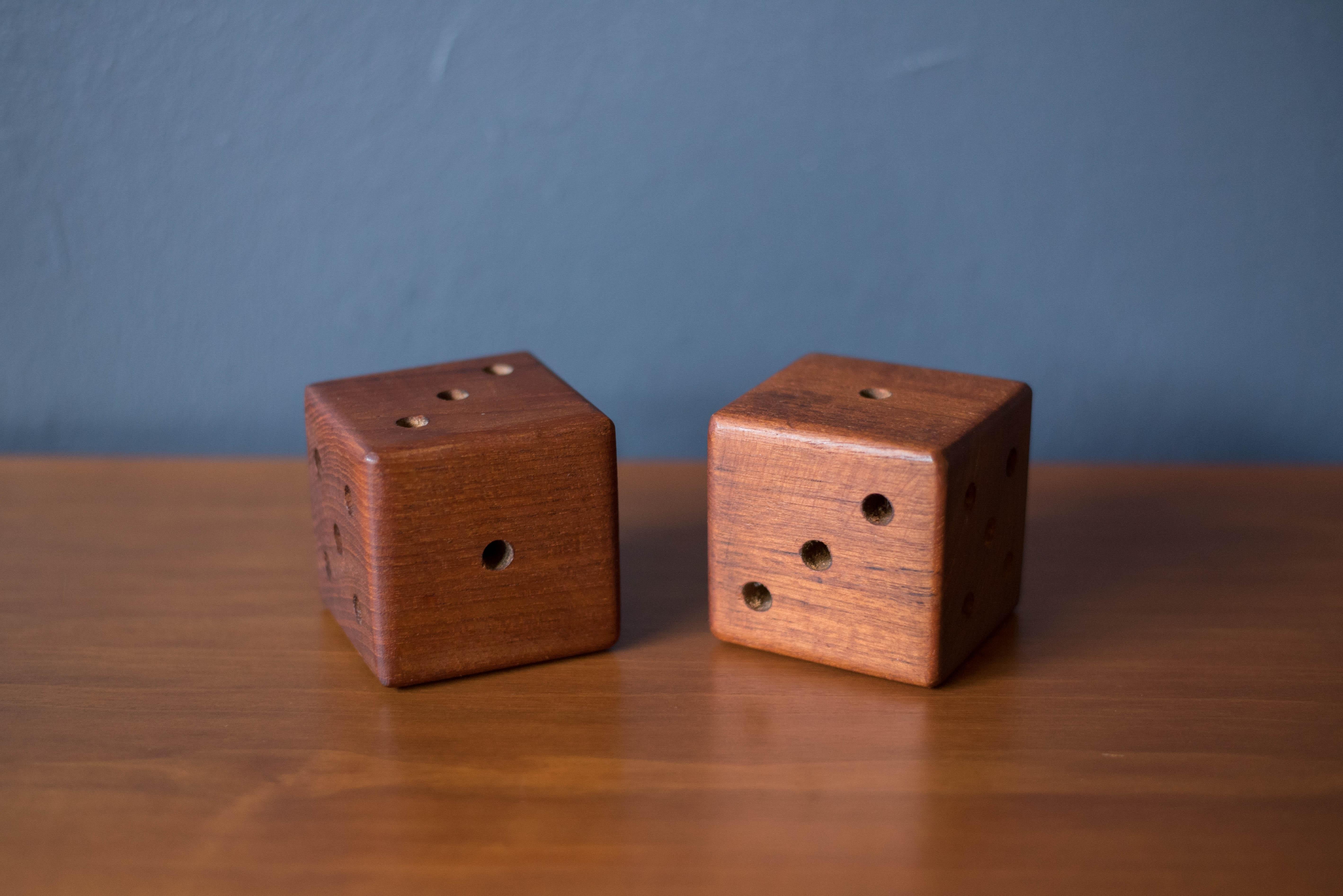 Vintage set of oversized wood dice, circa 1960s. This fun and unique pair is handcrafted in old growth teak and can be accessorized with any modern decor.


Offered by Mid Century Maddist