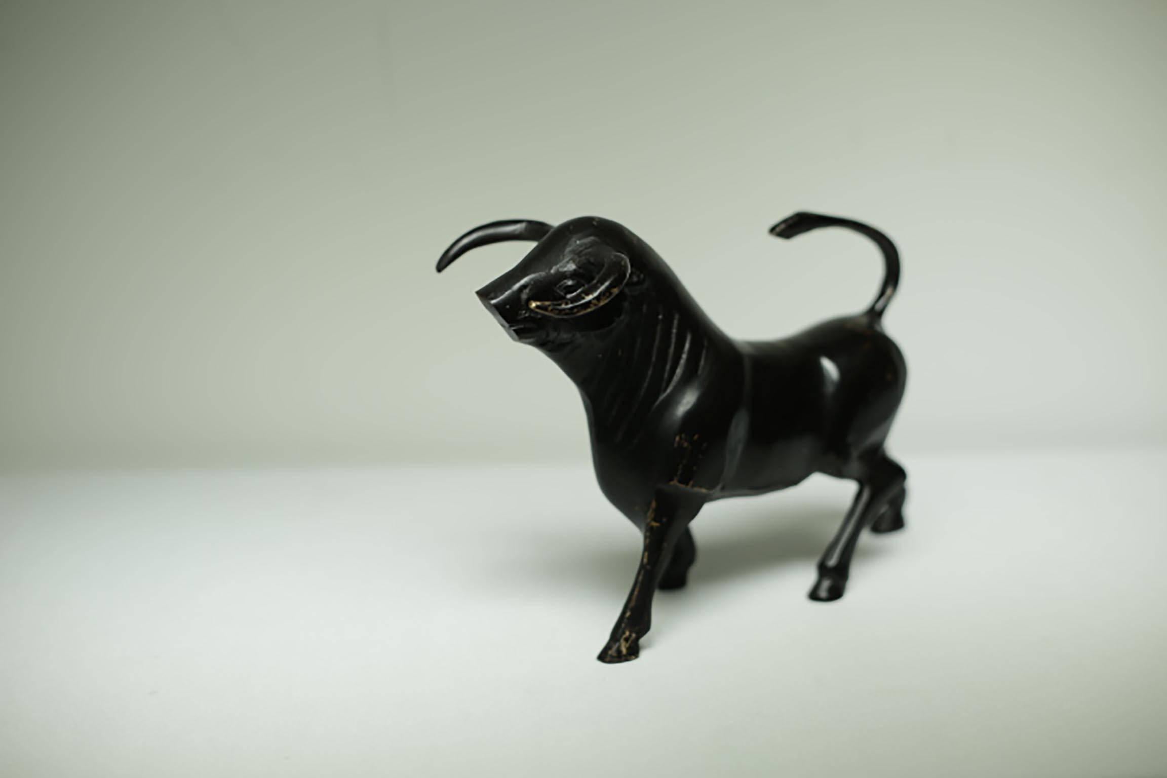 Midcentury distressed black painted bronze bull.