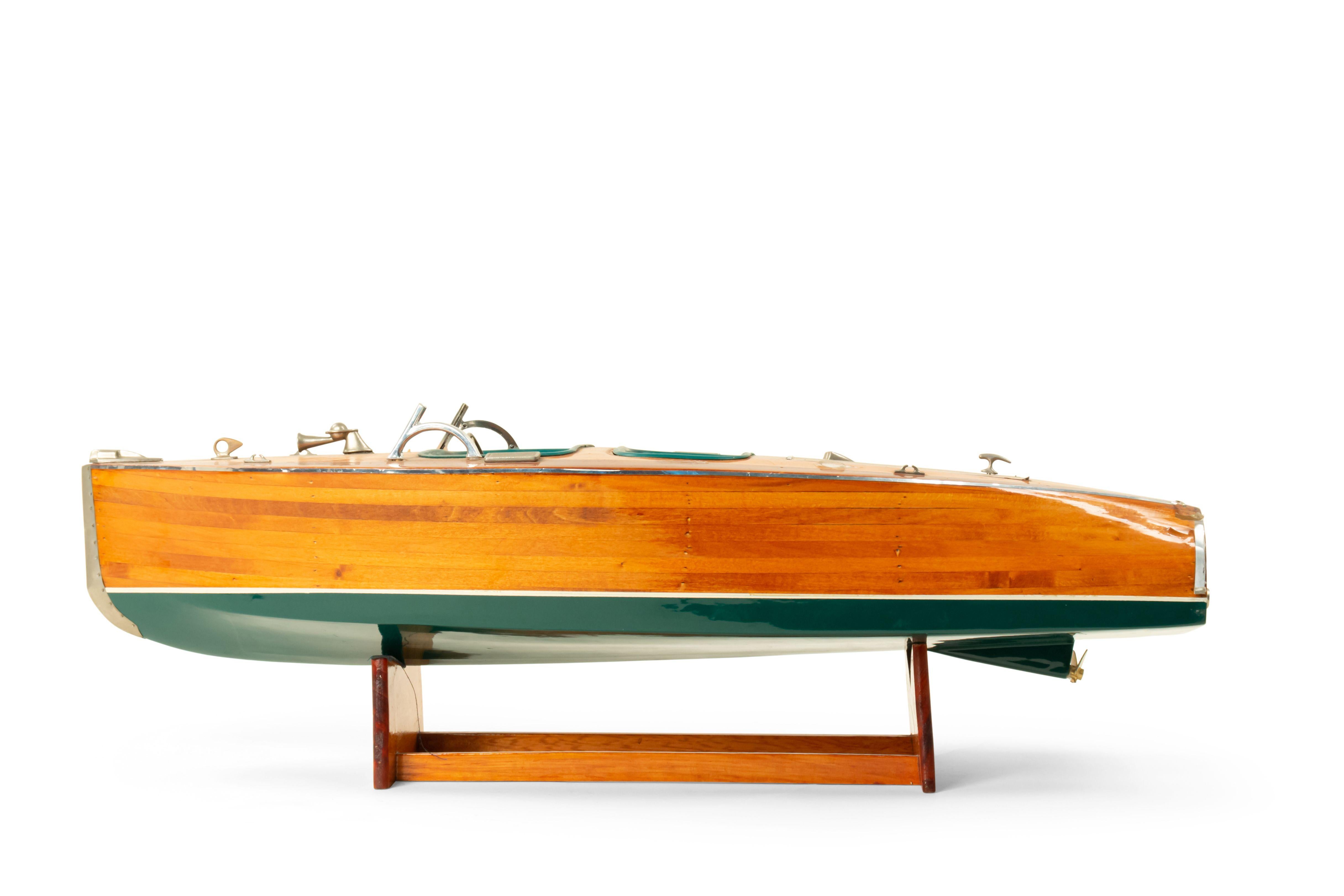 American Country Rustic style Mid-Century wood model of a motor boat with a green trim on a stand
