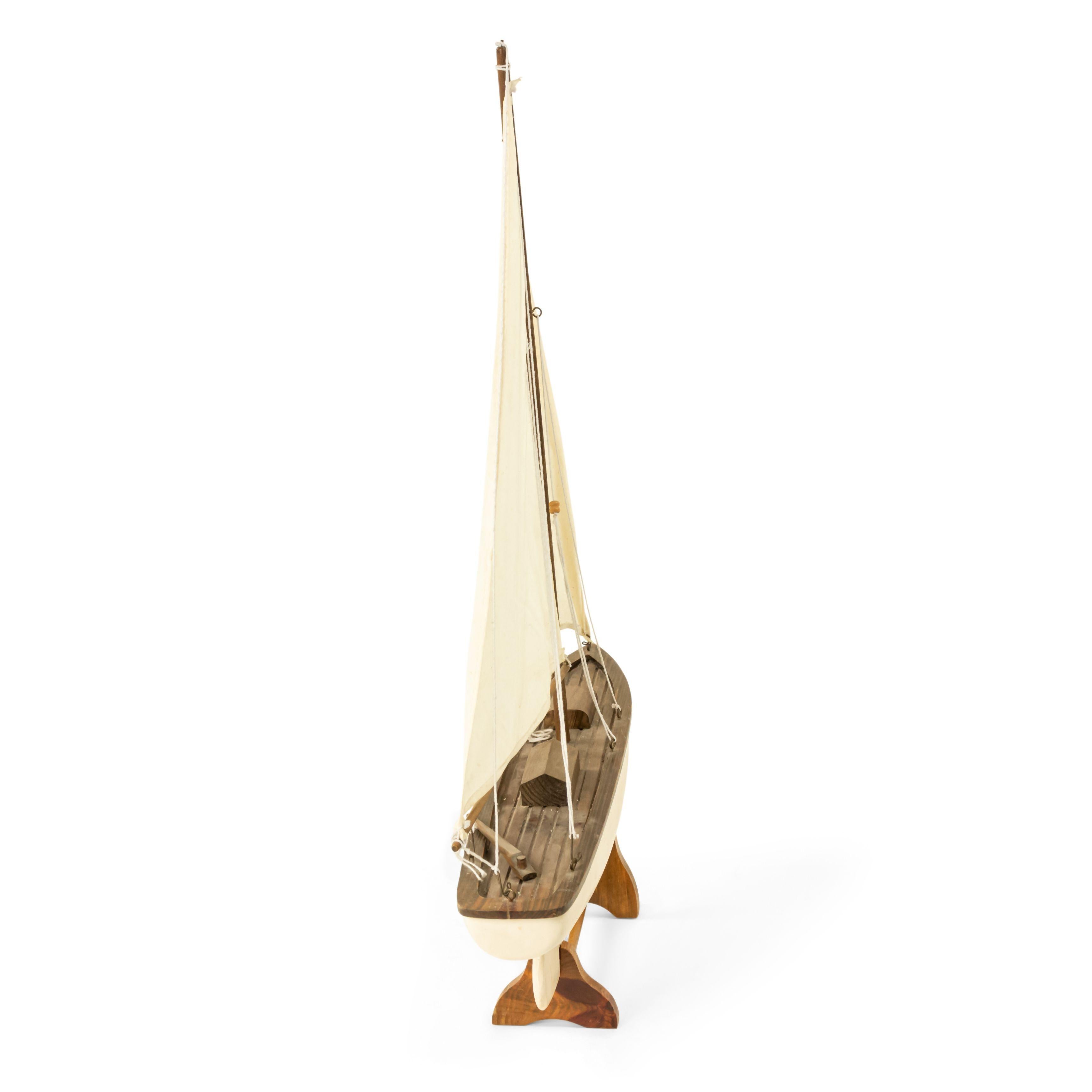 American Country style Mid-Century wood model of a pond sailboat on stand with a white painted hull