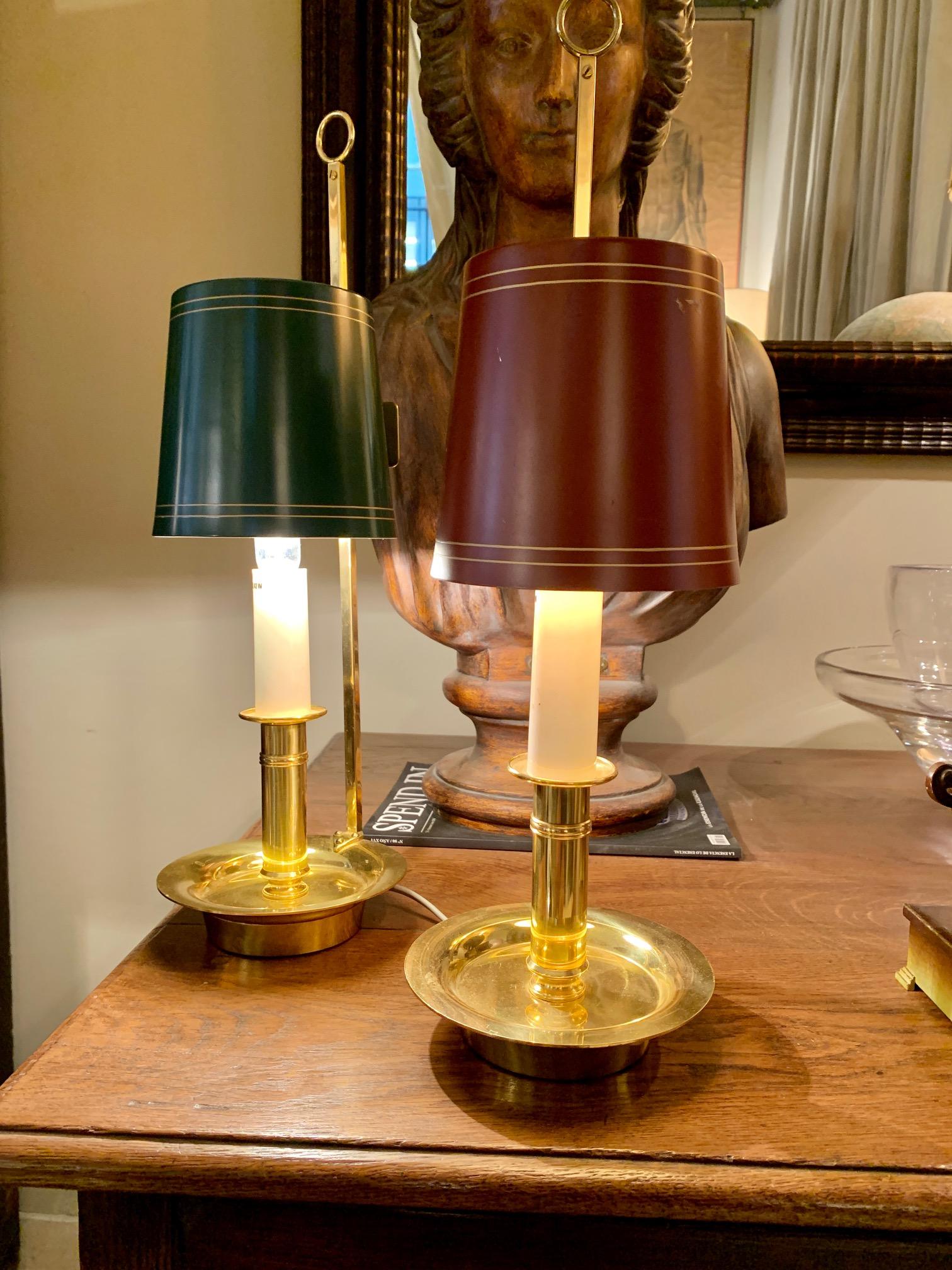 A pair of boullitte lamps, in gold brass and metal lampshade, can be used both to place them on a table and to hang them on the wall as a wall lamp.
