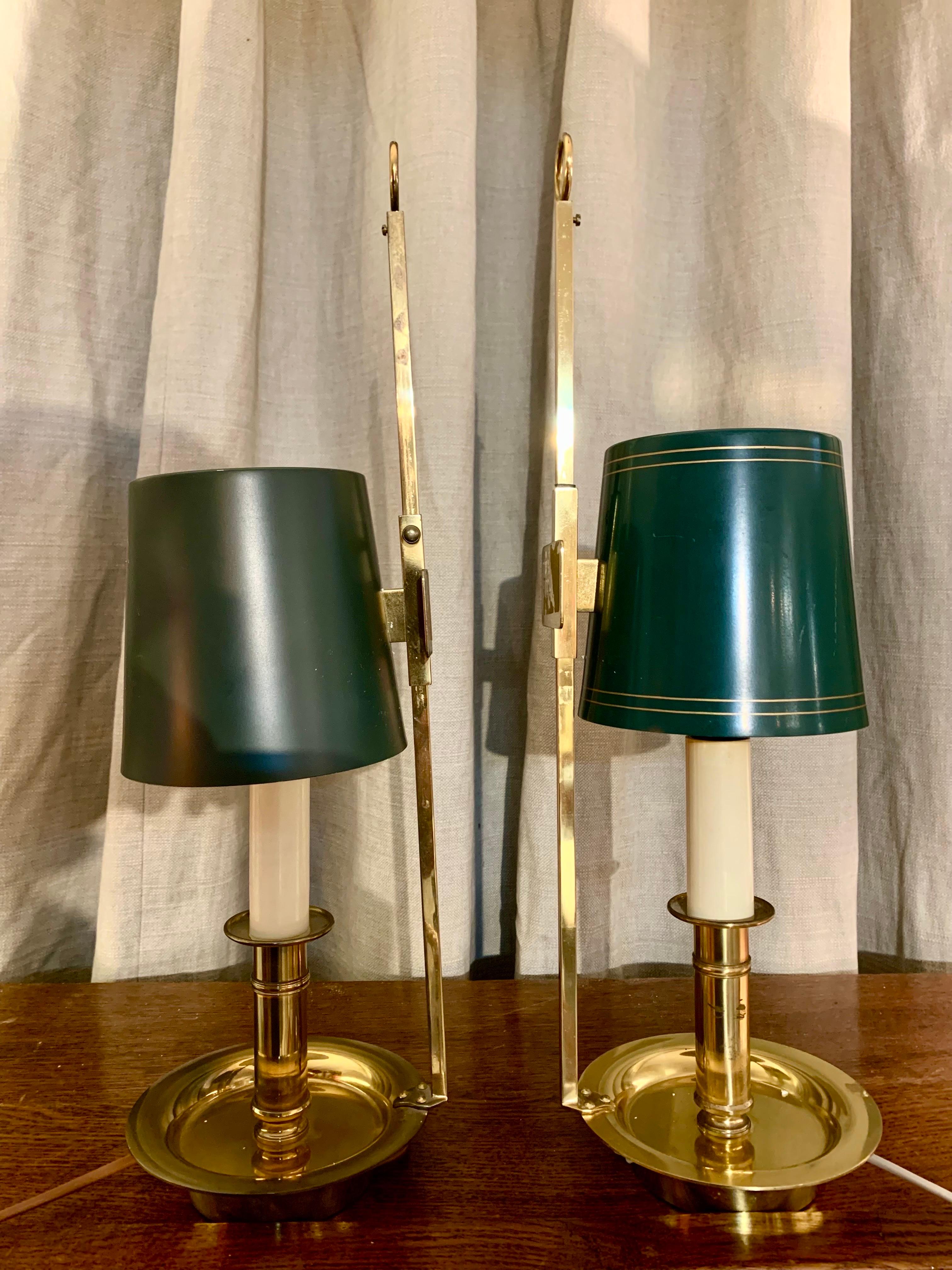 Apair of boullitte lamps, in gold brass and metal painted lampshades, can be used both to place them on a table and hang them on the wall as a wall sconces lamp.The height of the lampshade can be adjusted