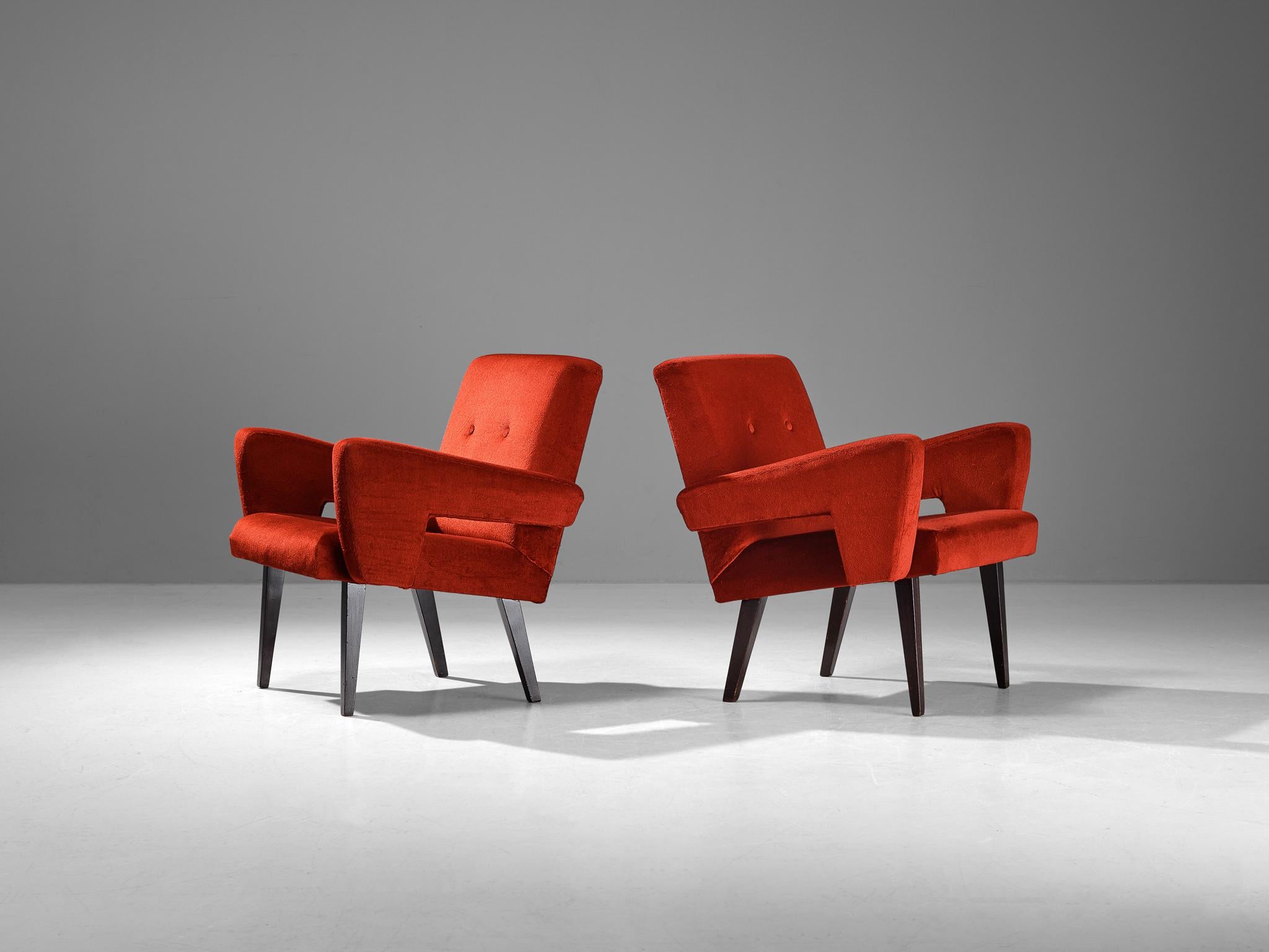 Pair of lounge chairs, velvet, stained beech, Czech Republic, 1960s

These well-proportioned armchairs are clear in their appearance with angular shapes and striking lines dominating the layout. A noticeable feature are the armrests that gradually