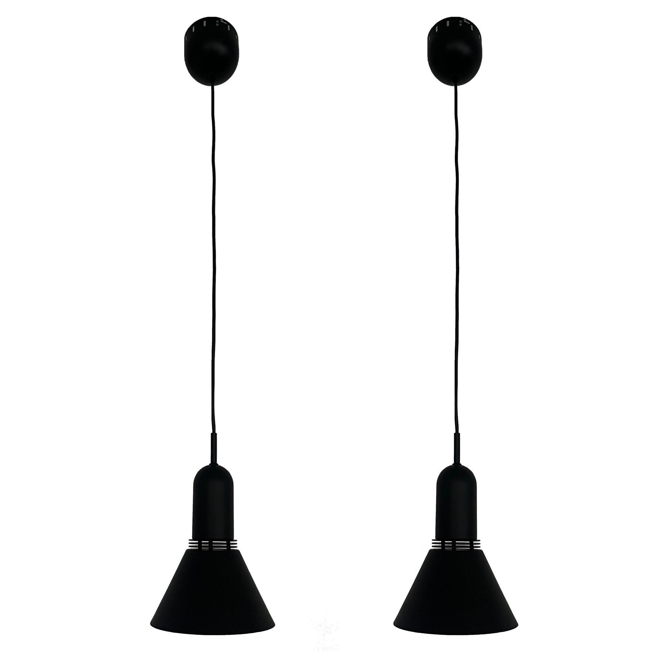 Beautiful Midcentury Pair of Black metal Long adjustable Chandeliers by Leonardo Marelli for Estiluz. Model: T-1142 Negro (black). These fixtures were designed and manufactured in Barcelona (Spain) during 1970s.
The condition is excellent, they