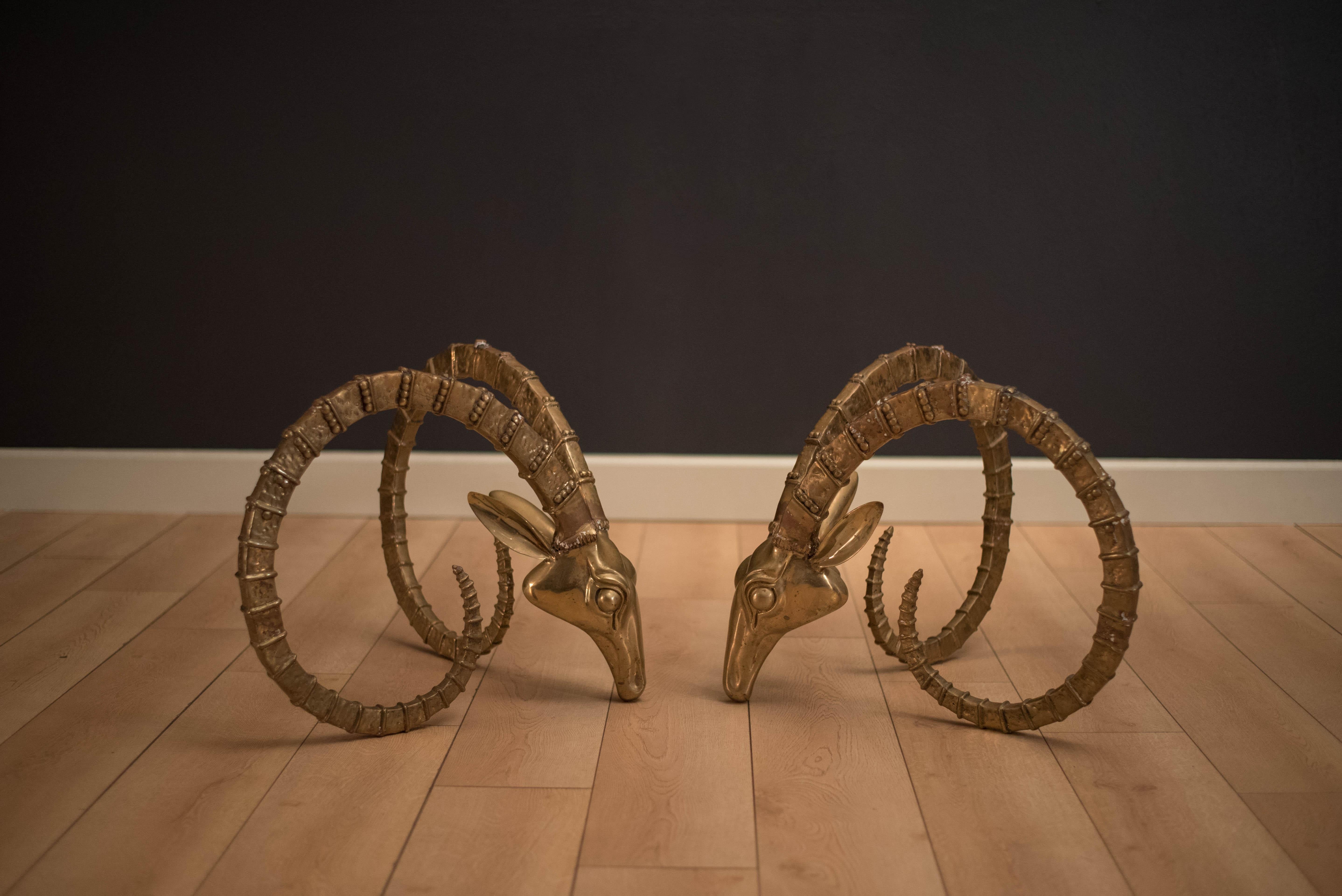 Vintage Ibex brass sculptures in the manner of Alain Chervet, circa 1970s. This set can be used with a glass top to form a coffee table or separately as end tables. Listing is for the bases only.