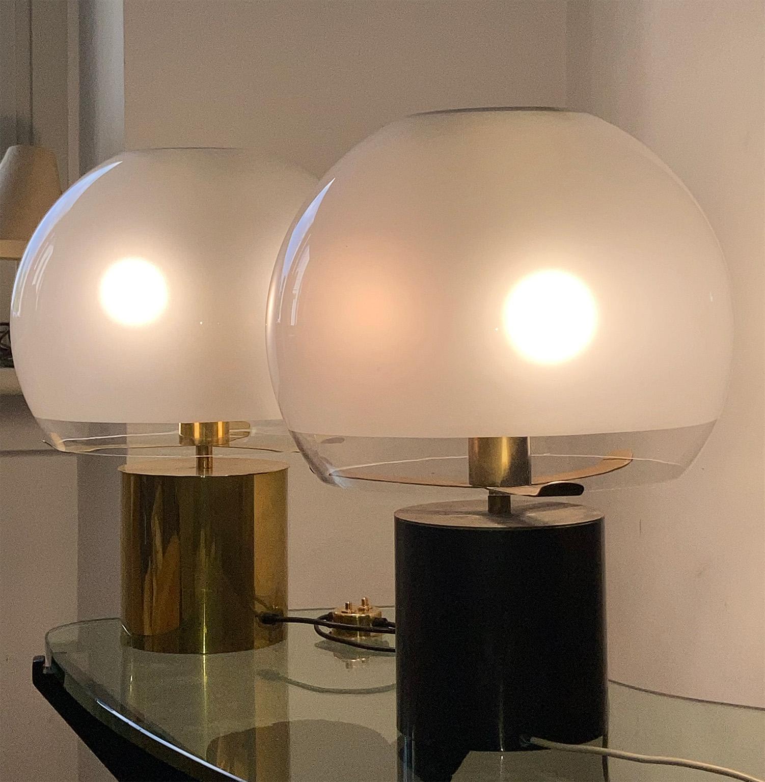 Pair of Monumental rare and fine brass table lamps,
 designed in 1966 by the Architect Luigi Caccia Dominioni for Azucena Manufacture; modello LTA6 “PORCINO”
The brass structure thanks to three brass tongues holds the large and beautiful glass