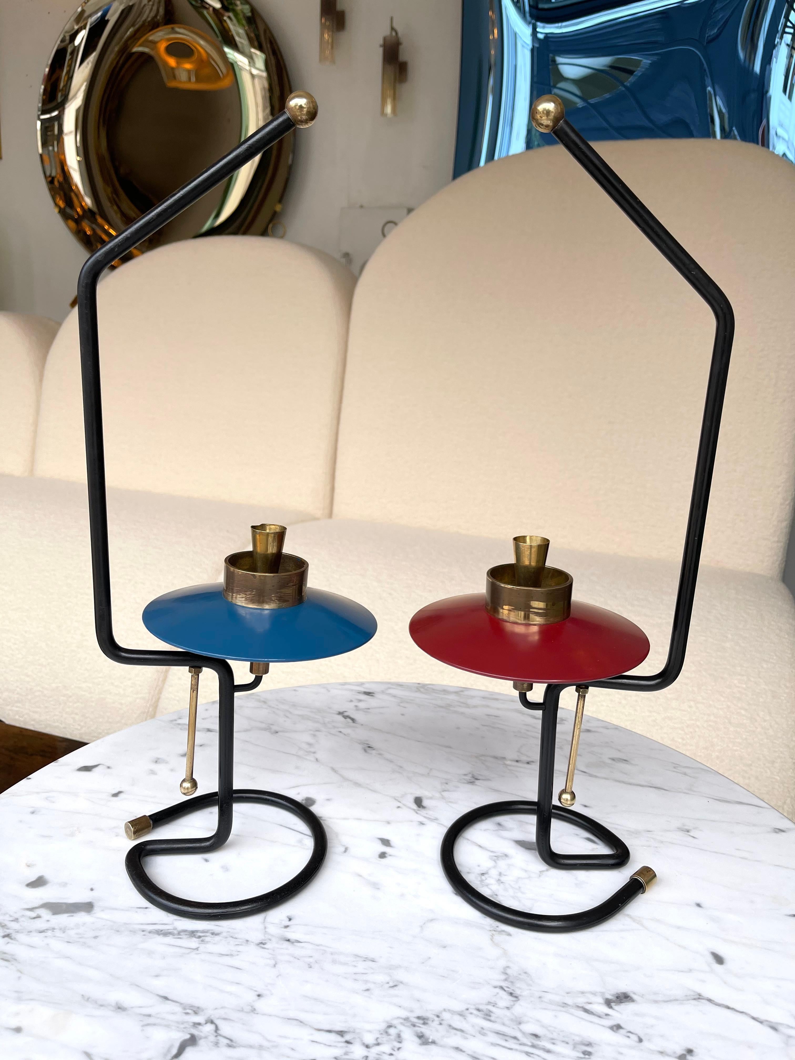 Unusual mid century pair of candle holders or candlesticks in black metal , lacquered red and blue metal and brass. In the mood of Stilnovo, Angelo Lelii for Esperia, Arteluce, Arredoluce, Angelo Brotto.