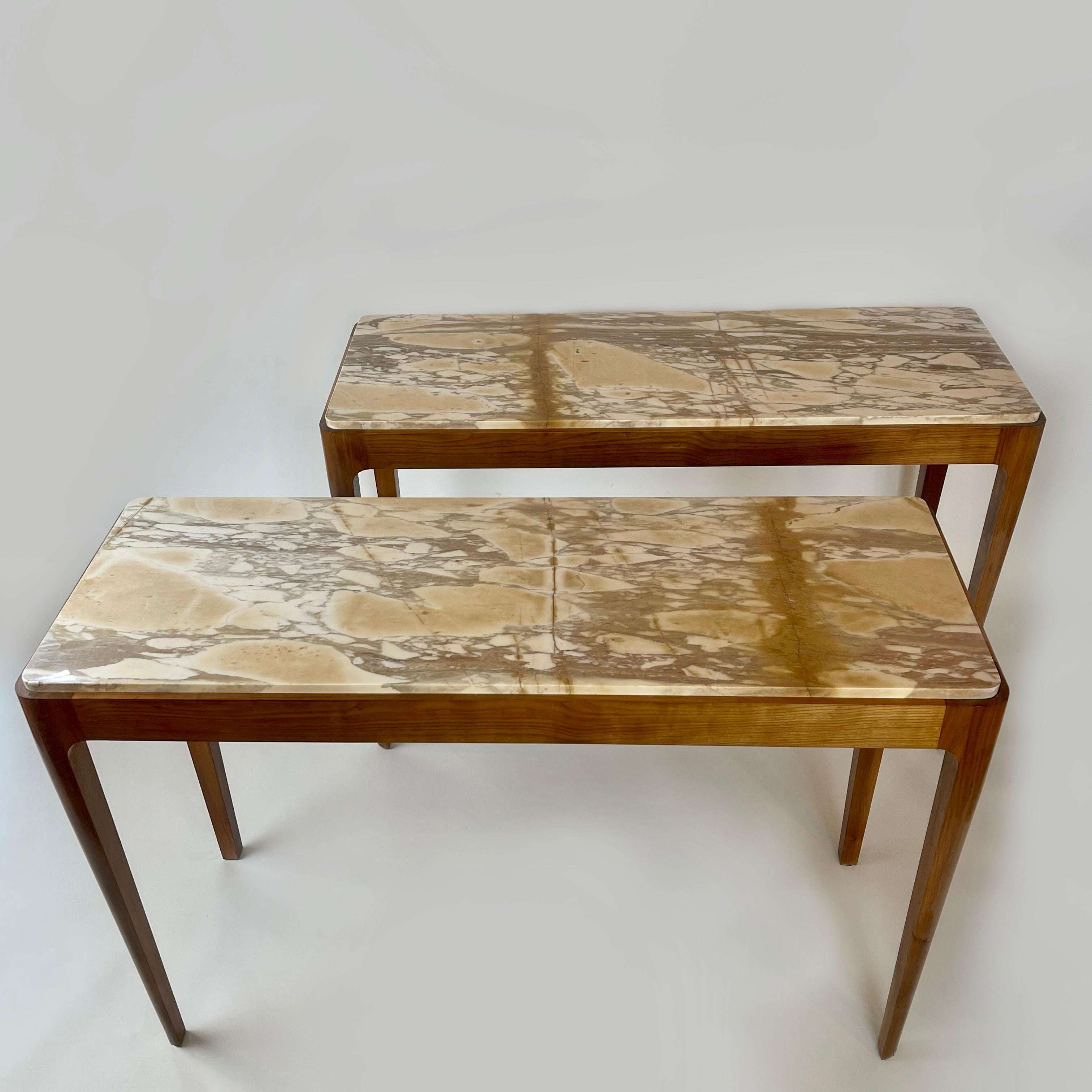 The cherry wood consoles are spirit-finished. 
Extremely elegant and very rare Broccatello Siena Marble on top of each one.
These yellow stones are stained with hazelnut, light brown and ivory colors.