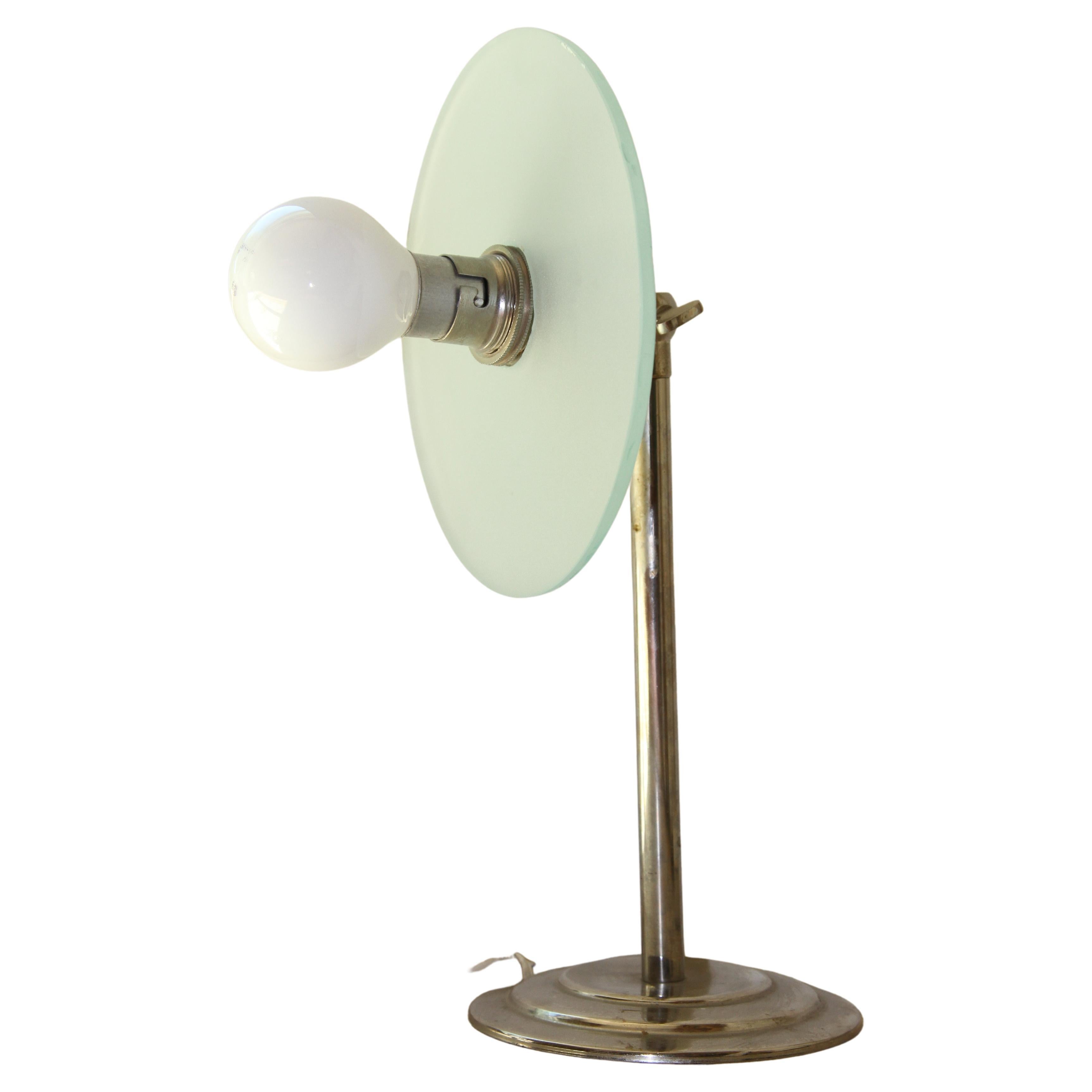 Rare pair of chrome Art-Deco or mid-century table lamp, with disc of frosted glass, in great order and functioning comes with 5 ft of cord.
the pair of a leaded base, This would be a valuable addition to any library or office space.

