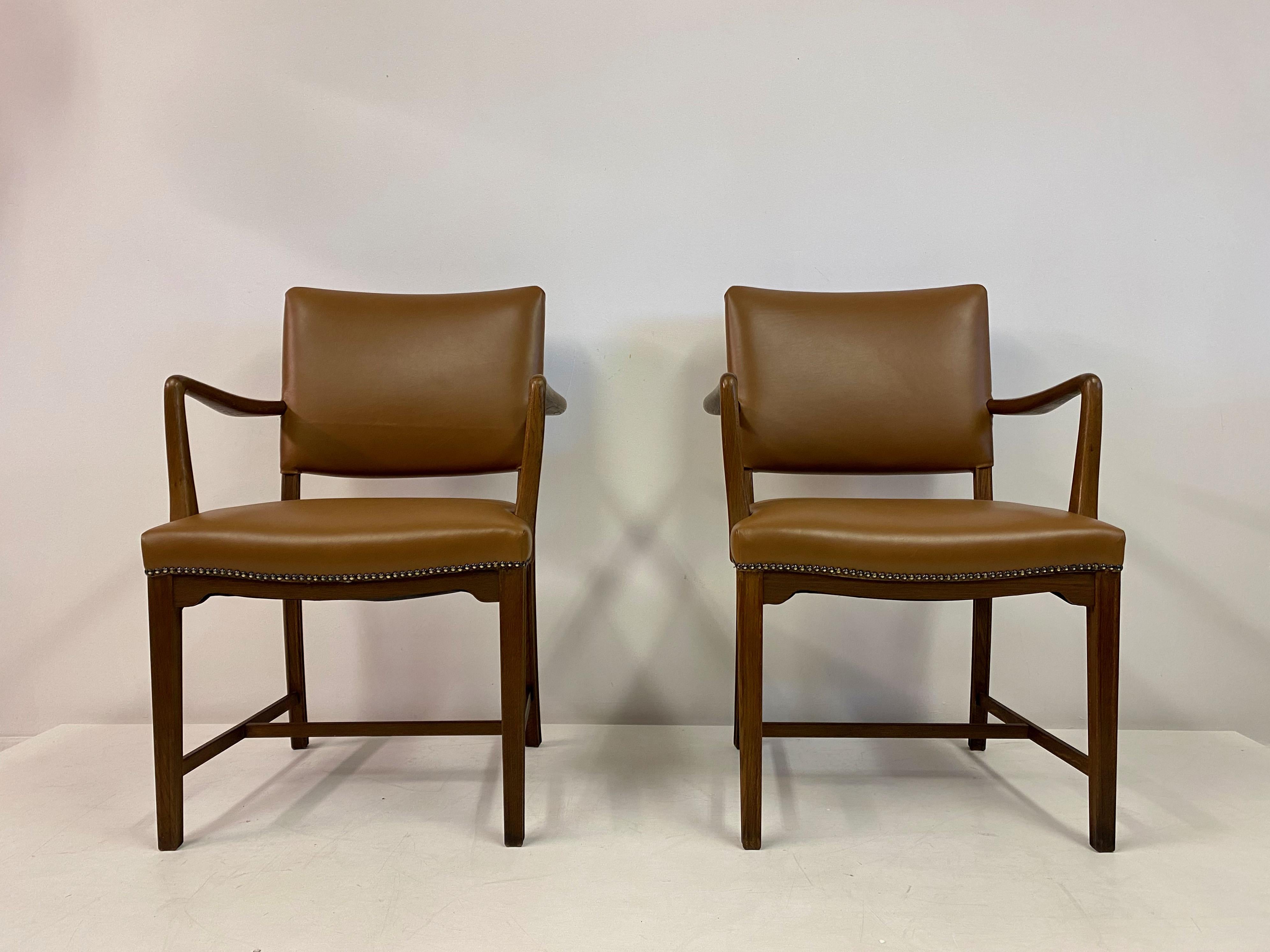 Pair of armchairs or desk chairs

Oak and beech frame

New tan leather upholstery

Retailed by Illums Bolighus (plaque underneath)

Can be sold separately

Seat height 46cm

Denmark, 1960s.