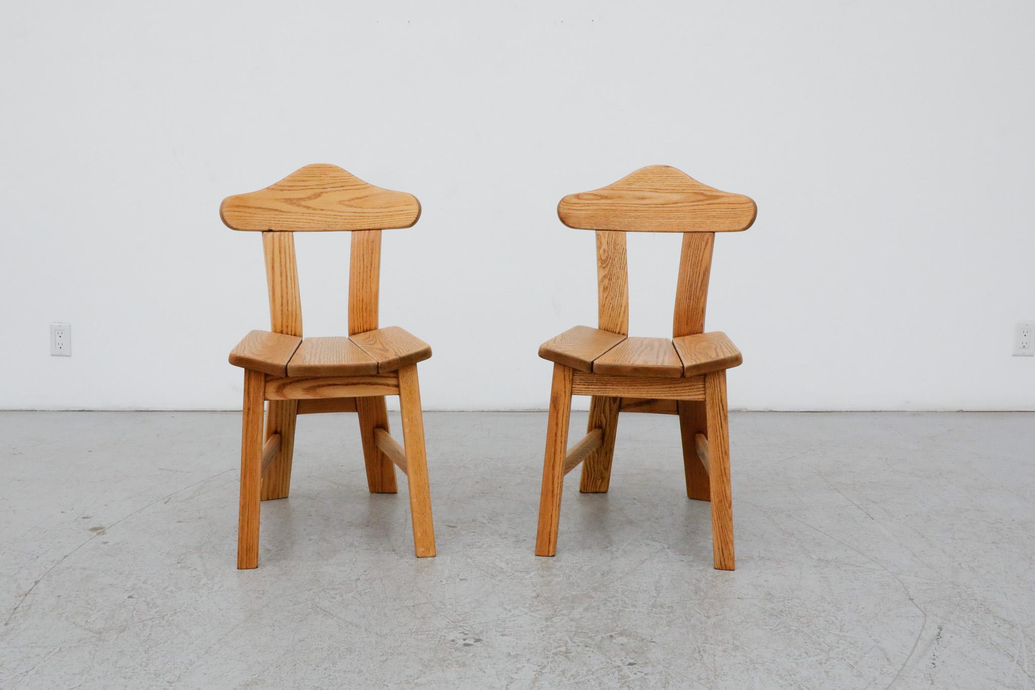Brutalist oak side chairs inspired by the work of Danish Mid-Century designer Rainer Daumiller. Perfect accent chairs, handsomely crafted from attractively hued natural oak. Lightly refinished in otherwise original condition with visible wear,